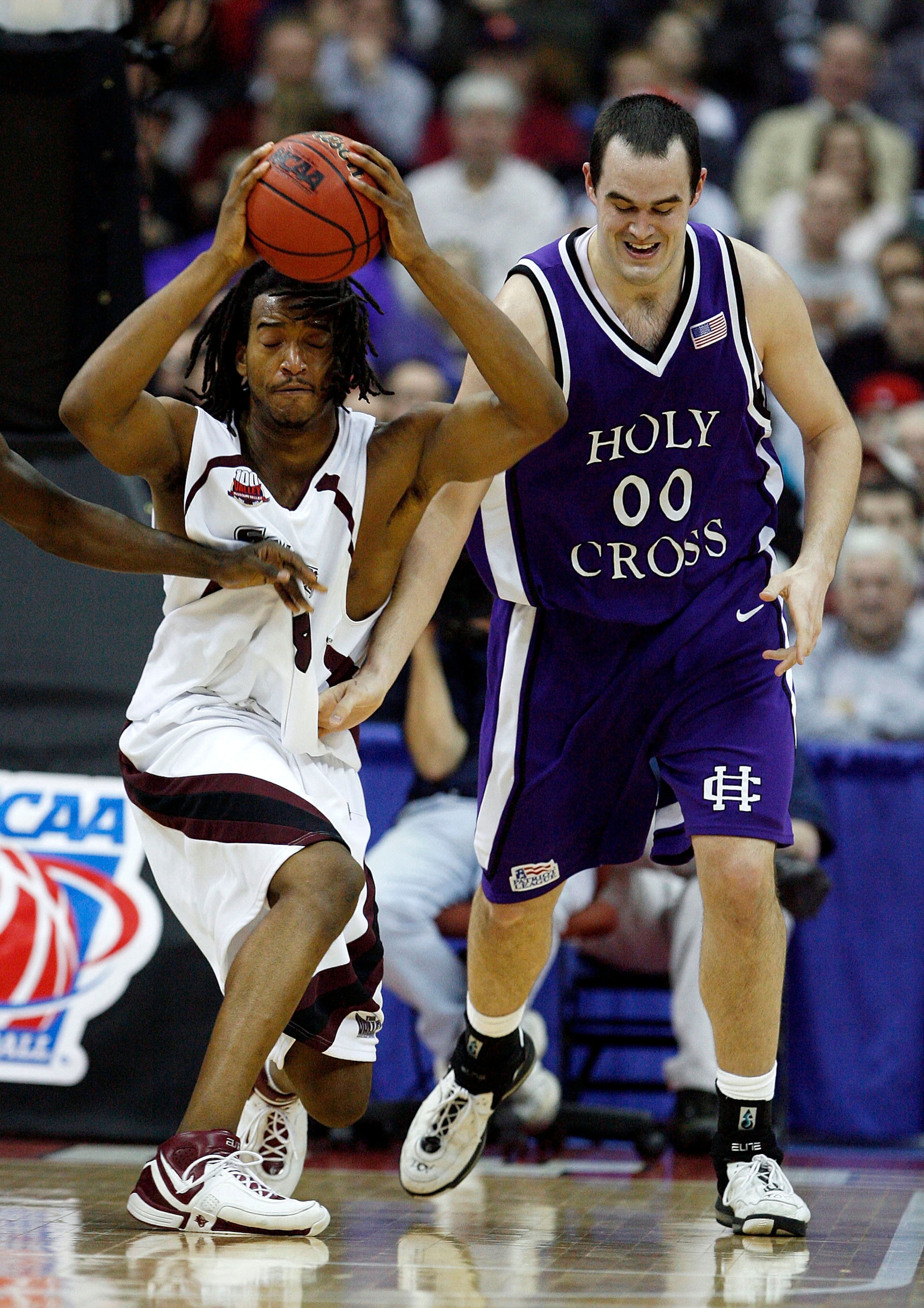 COLUMBUS, OH - MARCH 16:  Jamaal Tatum #3 of the Southern Illinois Salukis tries to keep the ball away from Tim Clifford #0 of the Holy Cross Crusaders during the first round of the NCAA Men's Basketball Tournament at Nationwide Arena on March 16, 2007 in