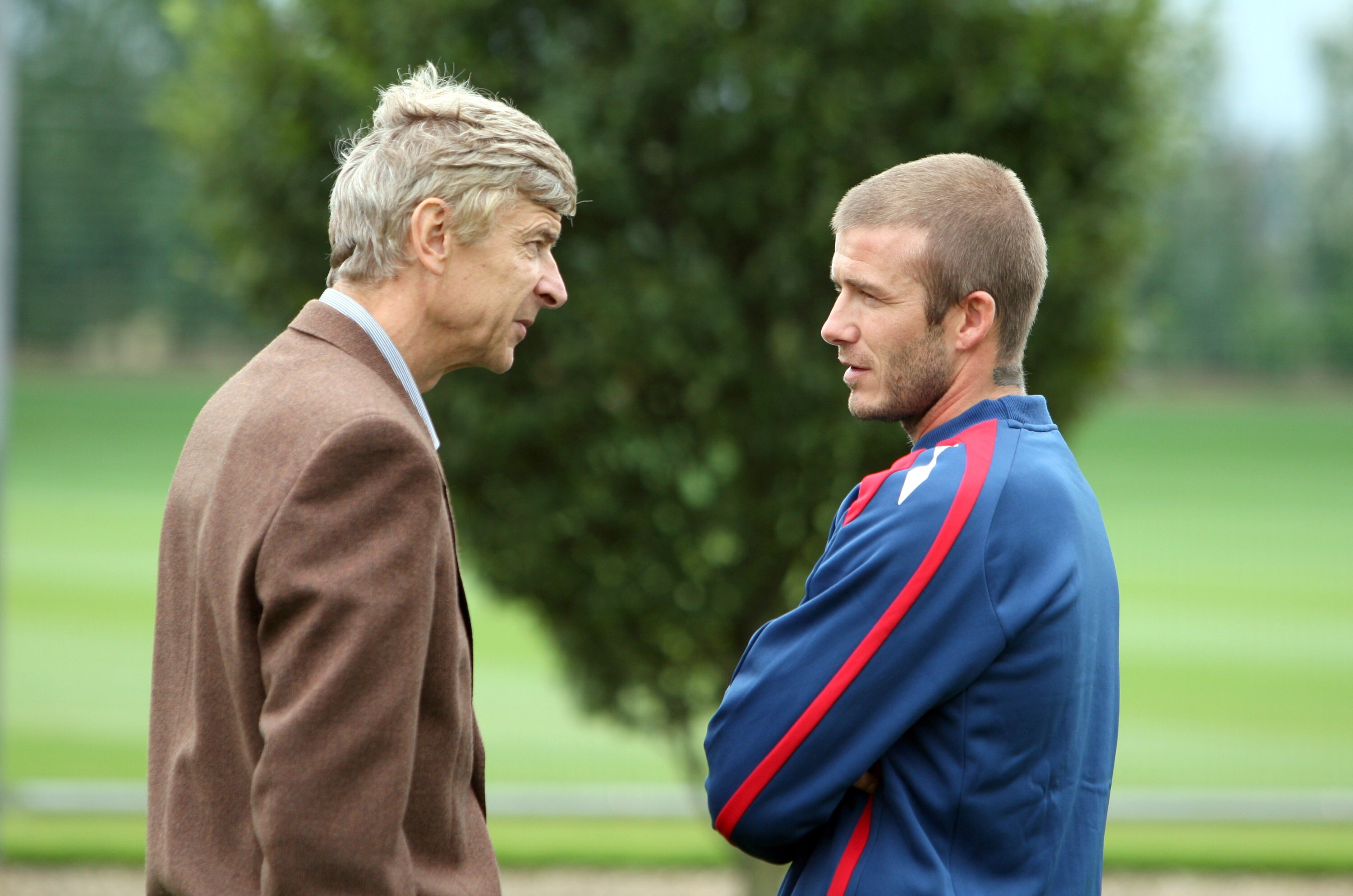 LONDON - AUGUST 20:  Arsenal manager Arsene Wenger with England's David Beckham during an England training session at the London Colney training ground on August 20, 2007 in London Colney, England.  (Photo by Phil Cole/Getty Images)