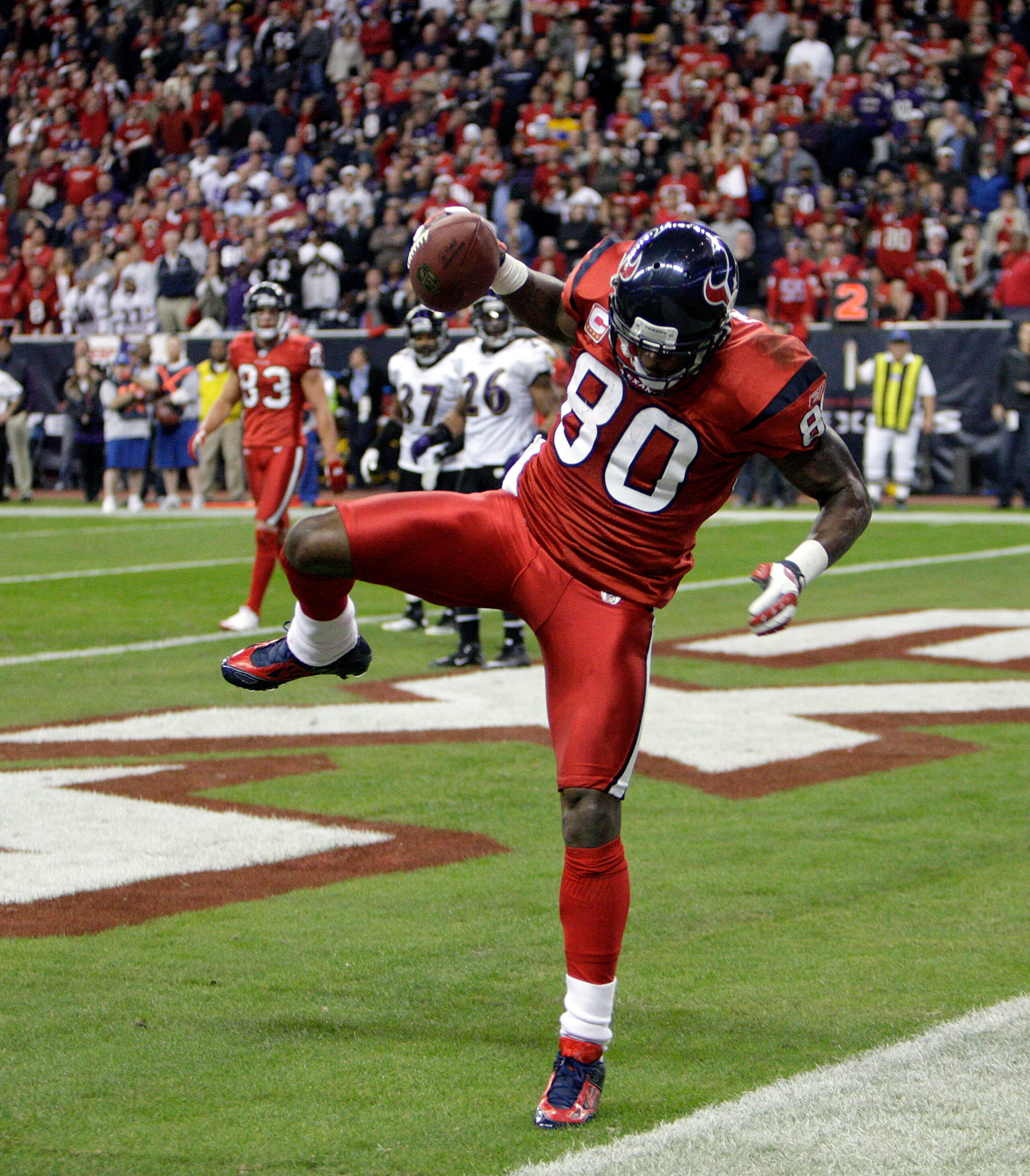 HOUSTON, TX - DECEMBER 13:  Wide receiver Andre Johnson #80 of the Houston Texans comes scores as he get's his foot down in the endzone in the fourth quarter against the Baltimore Ravens at Reliant Stadium on December 13, 2010 in Houston, Texas. Baltimore