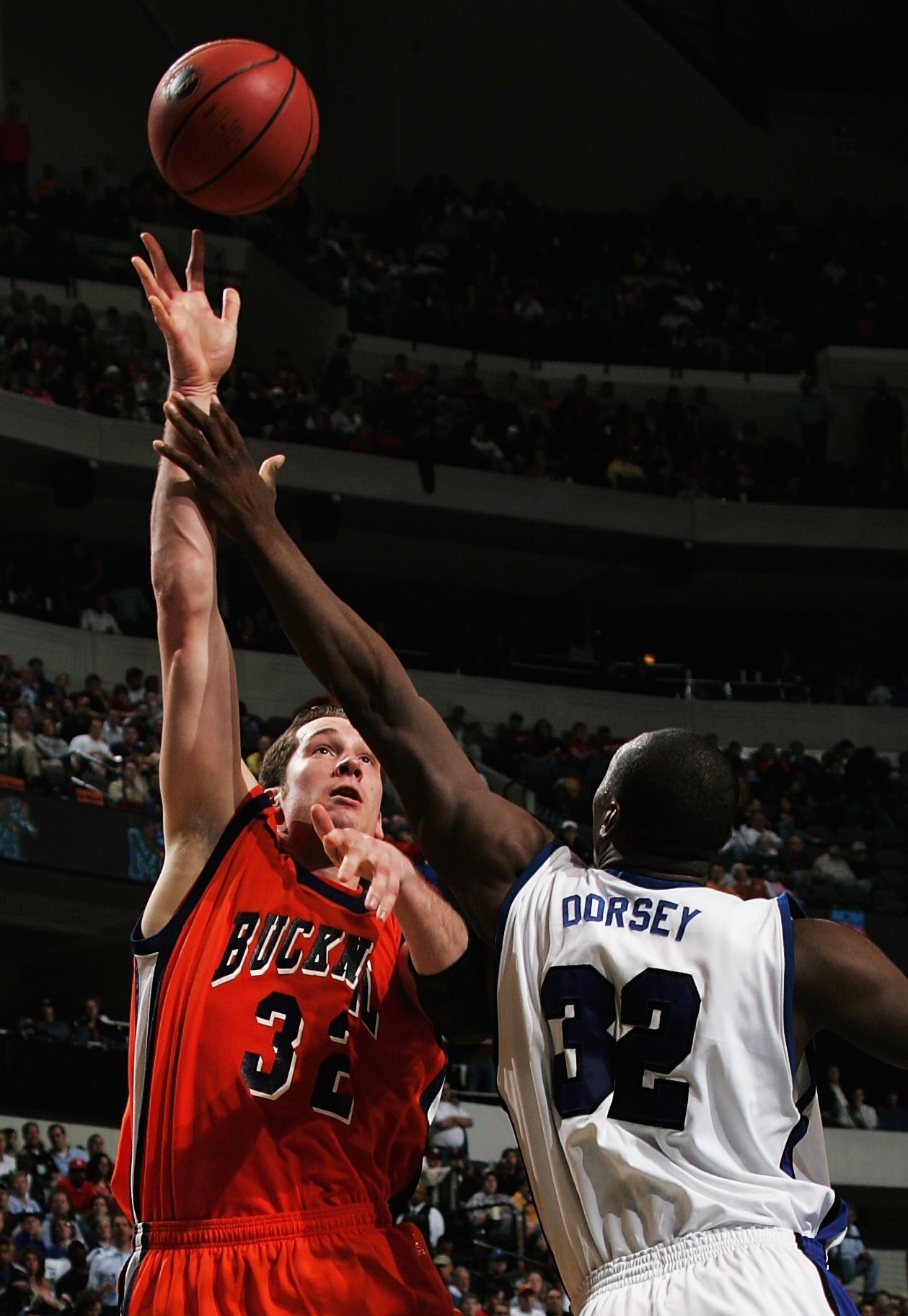 DALLAS, TEXAS - MARCH 19:  Chris McNaughton #32 of the Bucknell Bison takes a shot over Joey Dorsey #32 of the Memphis Tigers in the Second Round game of the 2006 NCAA Division 1 Men's Basketball Championship Tournament on March 19, 2006 at the American A