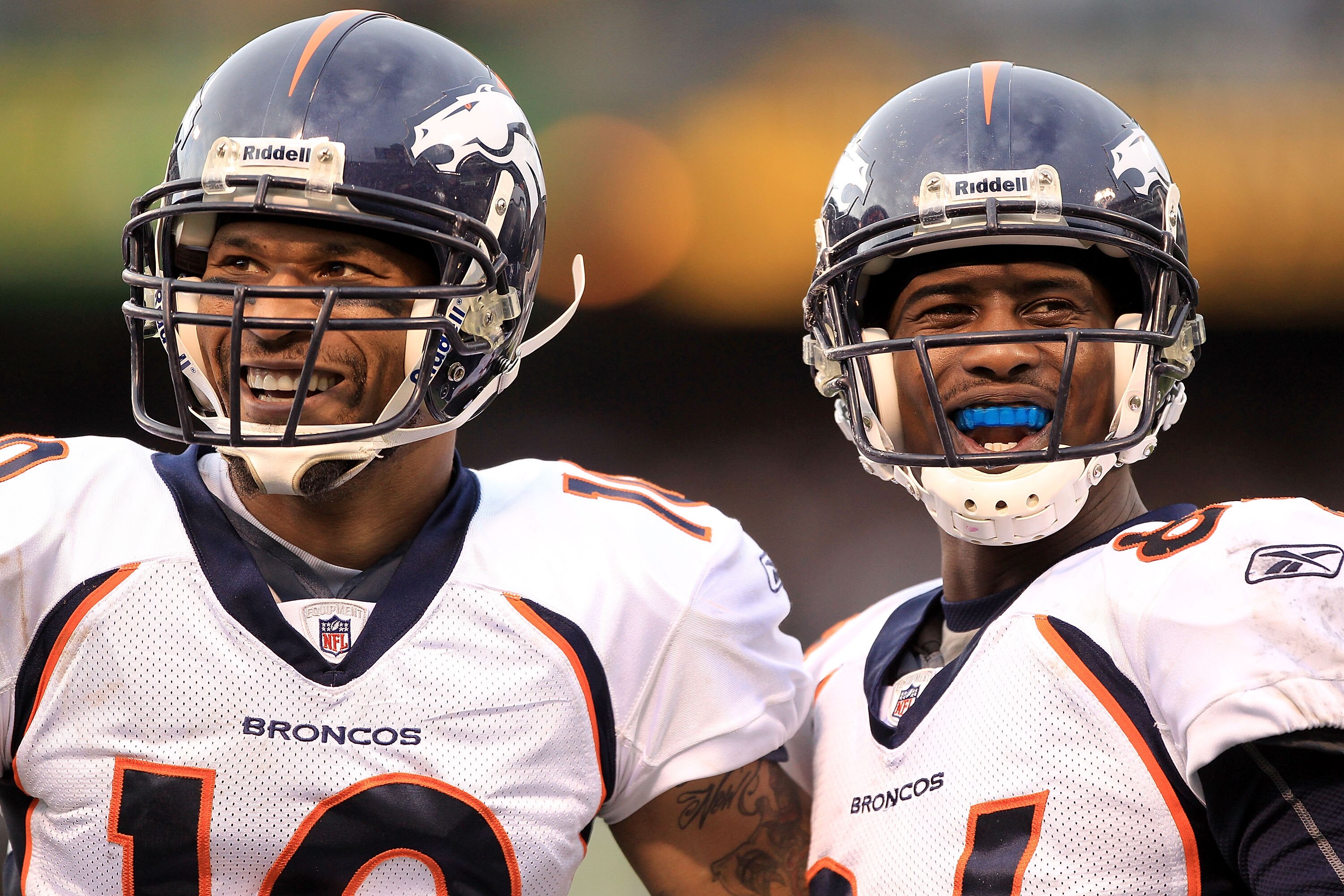 OAKLAND, CA - DECEMBER 19:  Jabar Gaffney #10 (left) and Brandon Lloyd #84 of the Denver Broncos smile at the Raider fans during their game against the Oakland Raiders at Oakland-Alameda County Coliseum on December 19, 2010 in Oakland, California.  (Photo