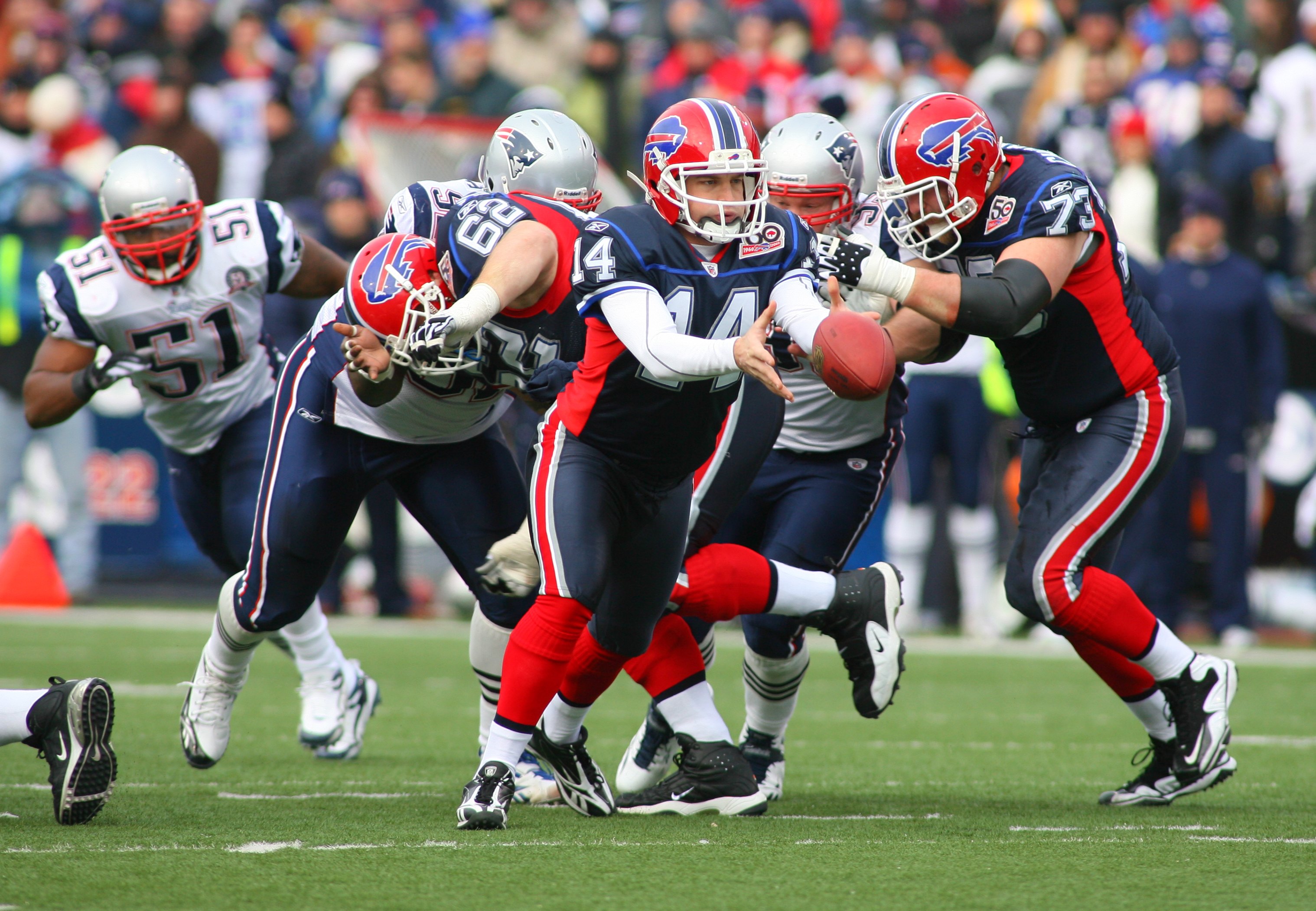 ORCHARD PARK, NY - DECEMBER 20: Ryan Fitzpatrick #14 of the Buffalo Bills looks to hand off the ball against the New England Patriots during the game at Ralph Wilson Stadium on December 20, 2009 in Orchard Park, New York. (Photo by: Rick Stewart/Getty Ima