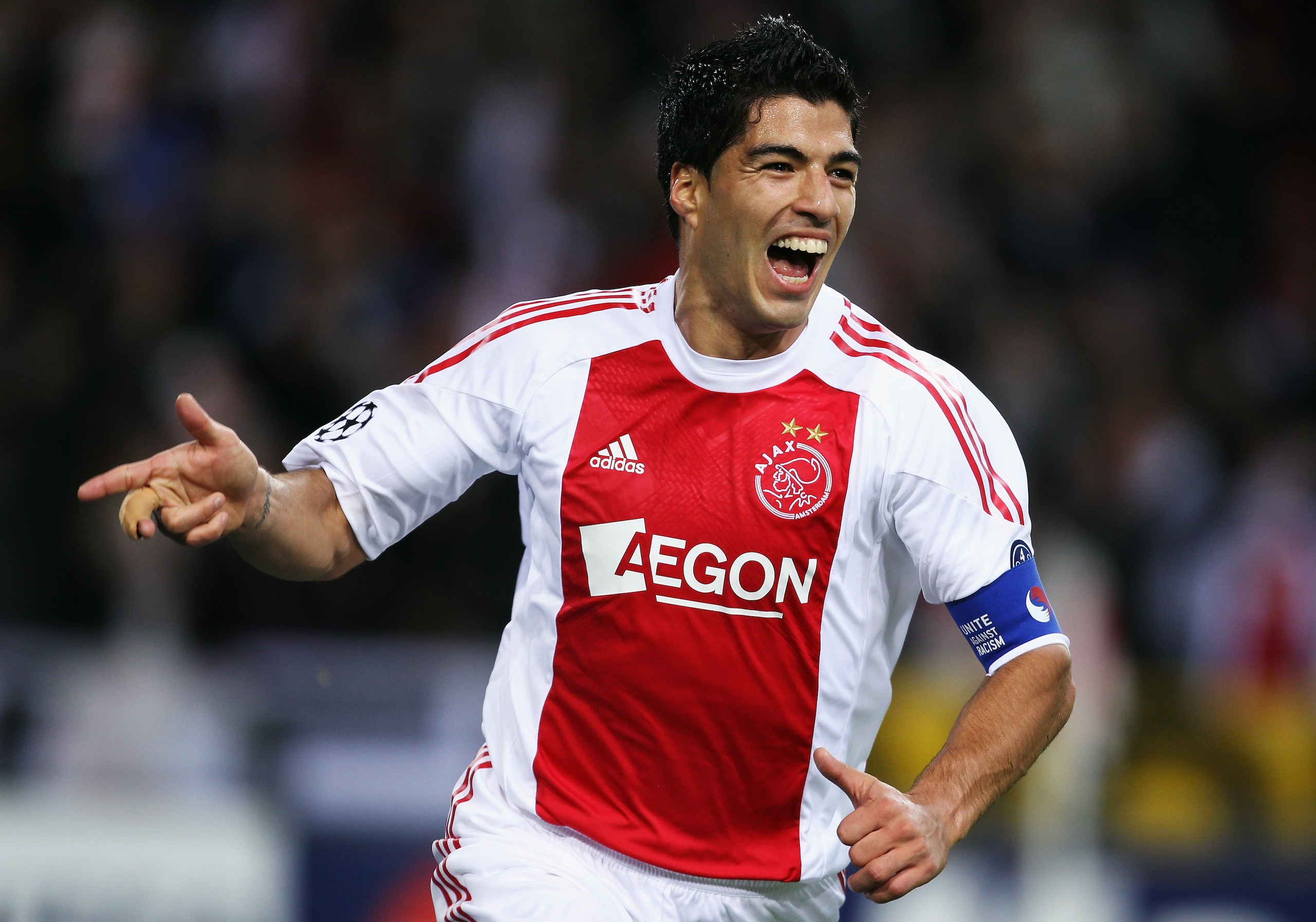 AMSTERDAM, NETHERLANDS - OCTOBER 19: Luis Suarez of AFC Ajax celebrates scoring during the UEFA Champions League Group G match between AFC Ajax and AJ Auxerre at the Amsterdam ArenA on October 19, 2010 in Amsterdam, Netherlands. (Photo by Bryn Lennon/Get AMSTERDAM, NETHERLANDS - OCTOBER 19: Luis Suarez of AFC Ajax celebrates scoring during the UEFA Champions League Group G match between AFC Ajax and AJ Auxerre at the Amsterdam ArenA on October 19, 2010 in Amsterdam, Netherlands. (Photo by Bryn Lennon/Get