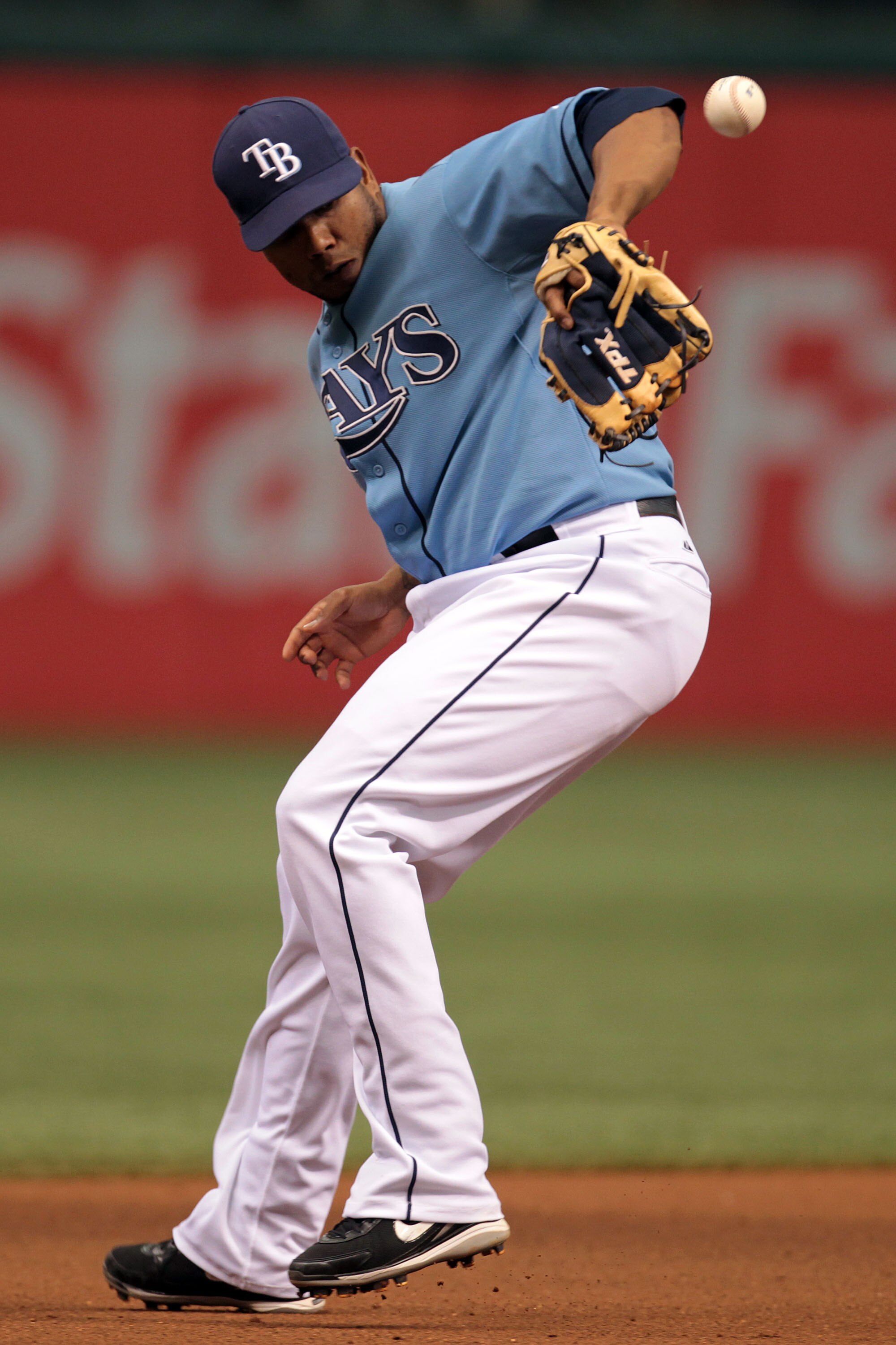 ST PETERSBURG, FL - SEPTEMBER 26: Third basemen Willy Aybar #16 of the Tampa Bay Rays miss judges the ball for an error in the 7th inning against the Seattle Mariners at Tropicana Field on September 26, 2010 in St. Petersburg, Florida. (Photo by Eliot J.
