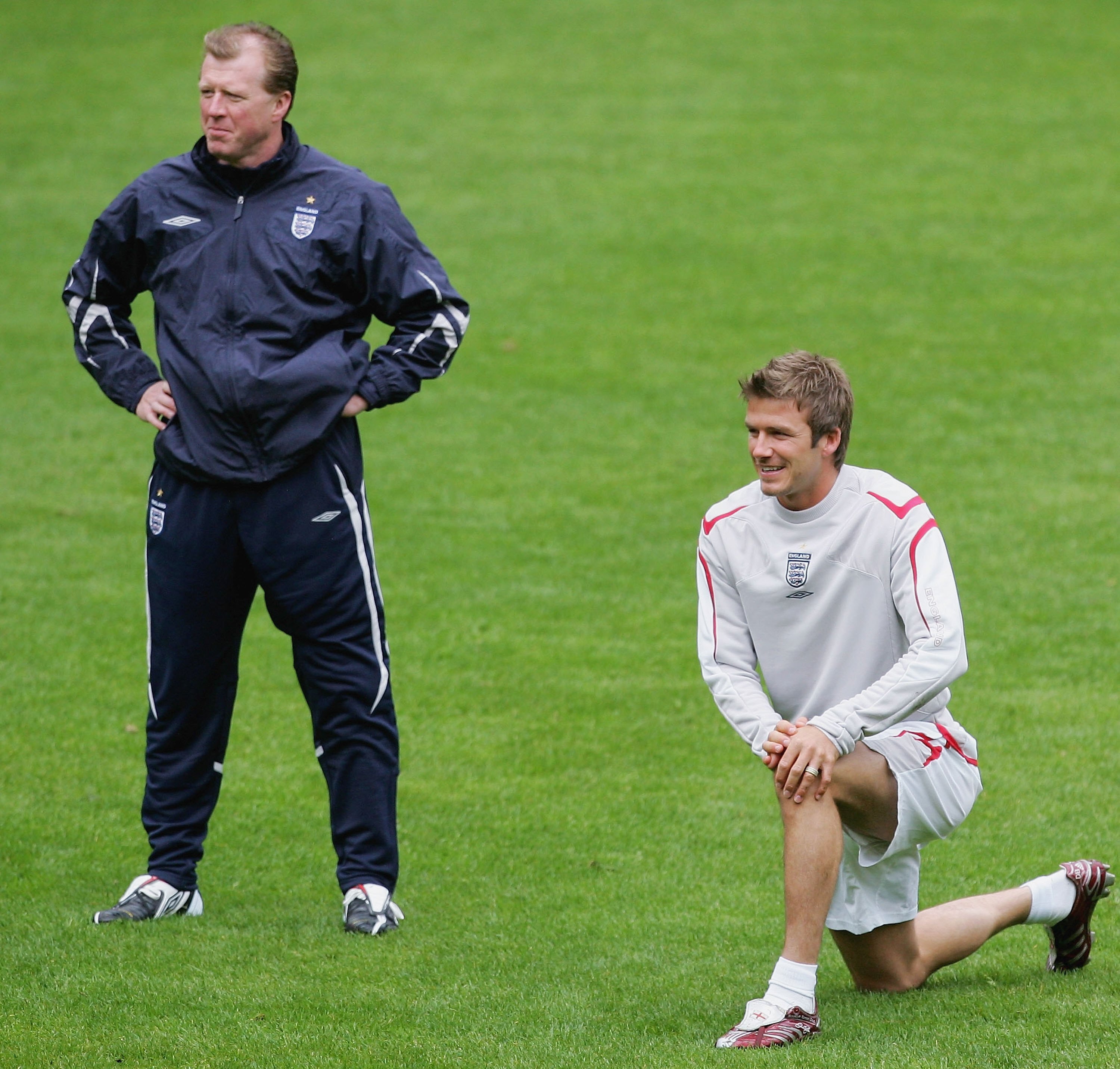 MANCHESTER, UNITED KINGDOM - MAY 29:  David Beckham (R) of England stretches in front of coach Steve McLaren during the England Training Session ahead of the International Friendy against Hungary at Old Trafford on May 29, 2006 in Manchester, England.  (P