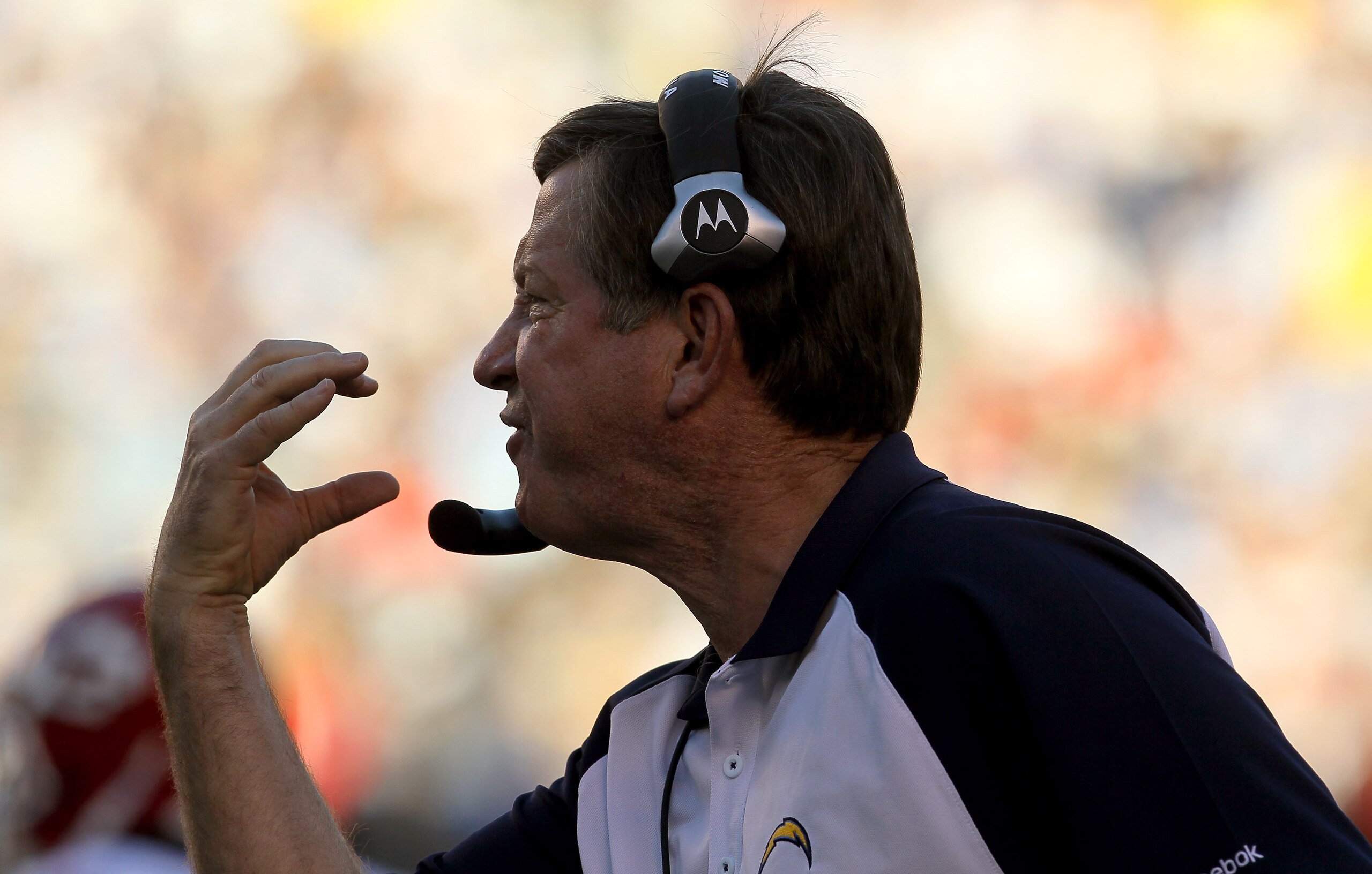SAN DIEGO - DECEMBER 12:  Head coach Norv Turner of the San Diego Chargers signals to an official that there should have been a facemask penalty against the Kansas City Chiefs at Qualcomm Stadium on December 12, 2010 in San Diego, California.  the Charger