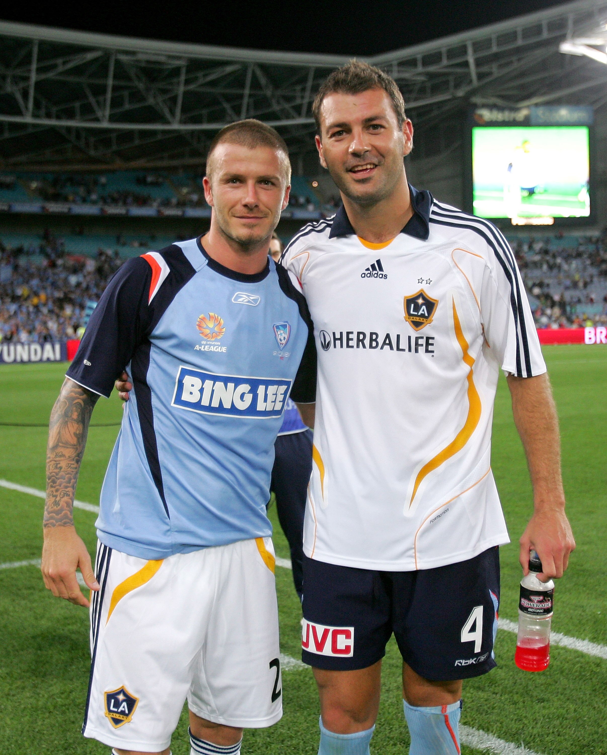 SYDNEY, AUSTRALIA - NOVEMBER 27:  David Beckham of the LA Galaxy poses with Mark Rudan of Sydney FC after the Hyundai Club Challenge match between Sydney FC and the LA Galaxy at Telstra Stadium on November 27, 2007 in Sydney, Australia.  (Photo by Ezra Sh