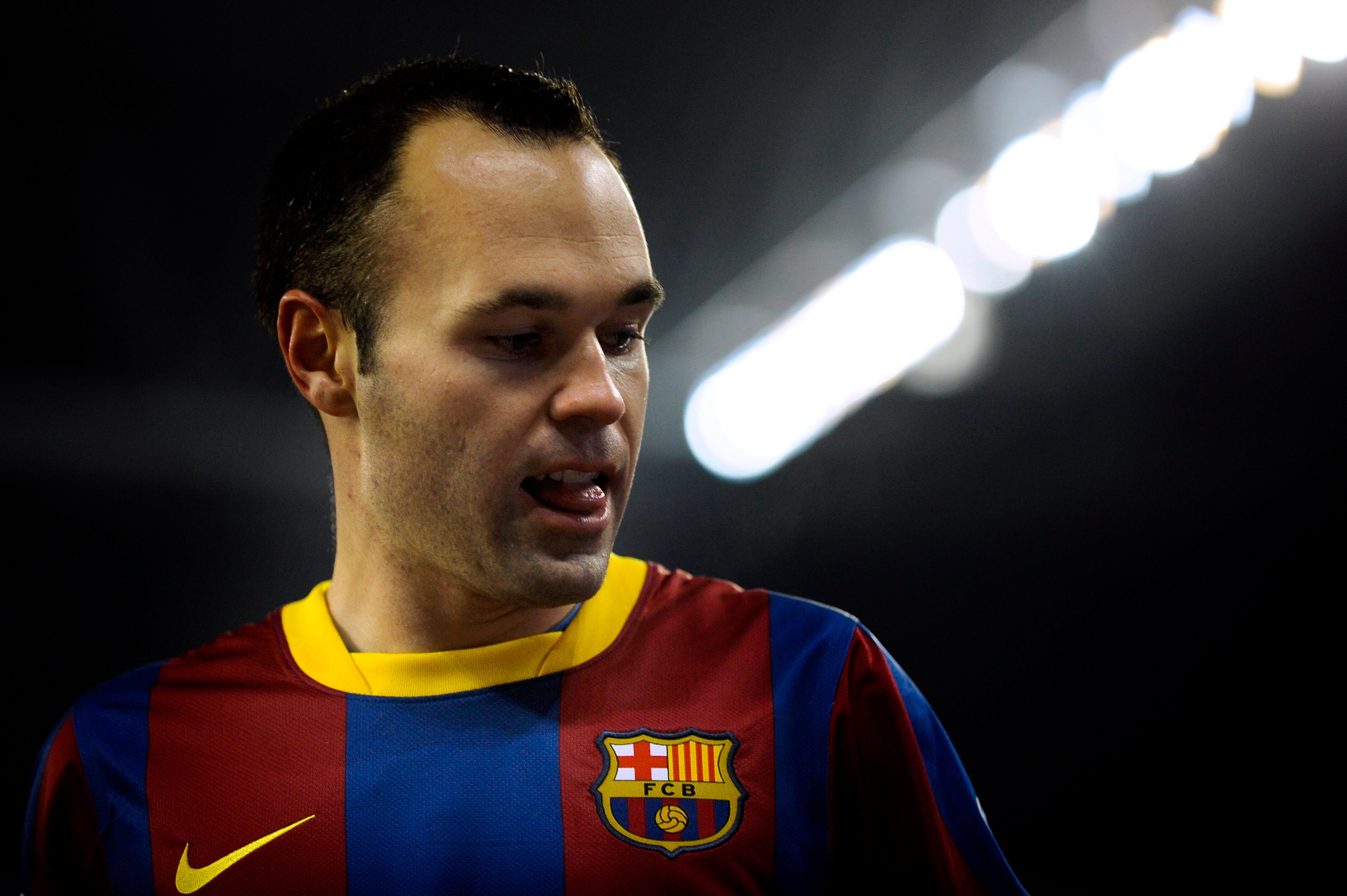 BARCELONA, SPAIN - DECEMBER 18:  Andres Iniesta of Barcelona looks on during the La Liga match between Espanyol and Barcelona at Cornella - El Prat stadium on December 18, 2010 in Barcelona, Spain. Barcelona won the match 1-5.  (Photo by David Ramos/Getty