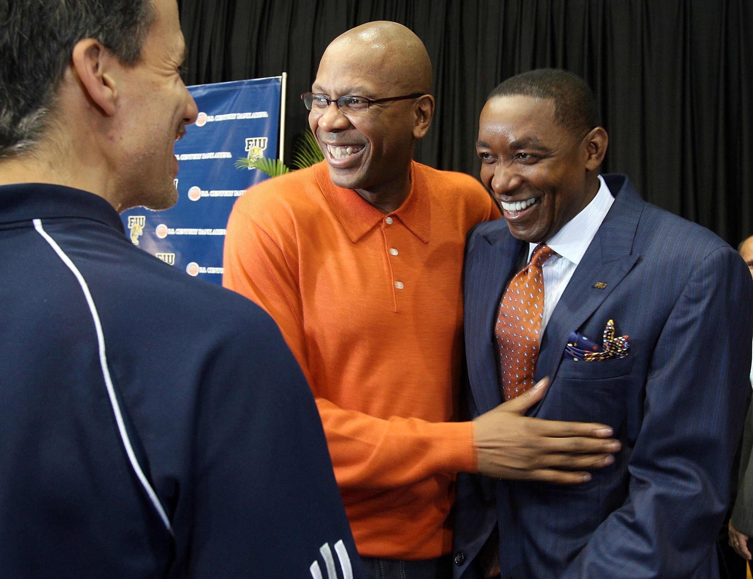 MIAMI - APRIL 15:  Isiah Thomas (R) laughs with Darrell Walker, assistant coach of the Detroit Pistons, before Thomas was introduced as the new head coach for Florida International Univeristy men's basketball team at U.S.Century Bank Arena on April 15, 20