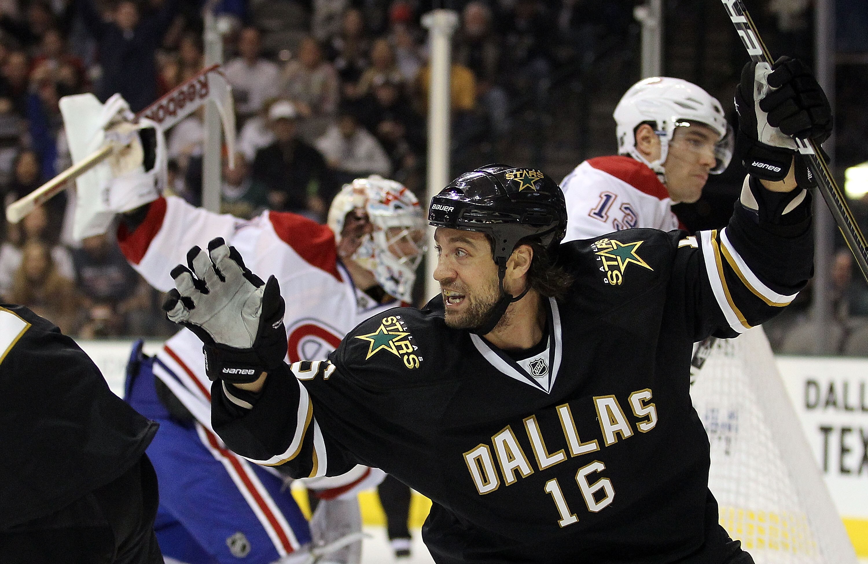 DALLAS, TX - DECEMBER 21:  Right wing Adam Burish #16 of the Dallas Stars celebrates a short handed goal against the Montreal Canadiens at American Airlines Center on December 21, 2010 in Dallas, Texas.  (Photo by Ronald Martinez/Getty Images)