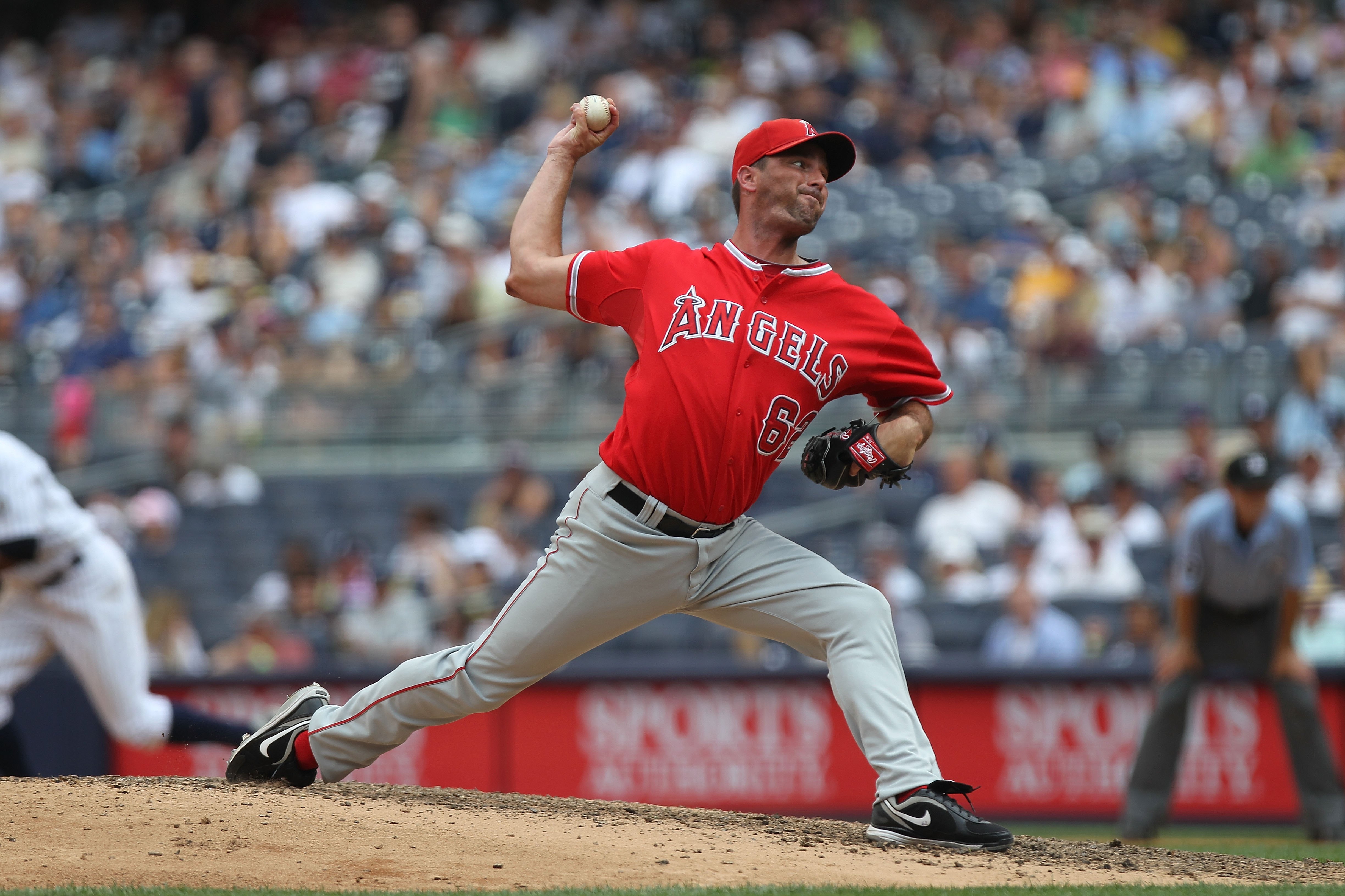 NEW YORK - JULY 21:  Scot Shields #62 of the Los Angeles Angels of Anaheim pitches against the New York Yankees at Yankee Stadium on July 21, 2010 in the Bronx borough of New York City.  (Photo by Nick Laham/Getty Images)
