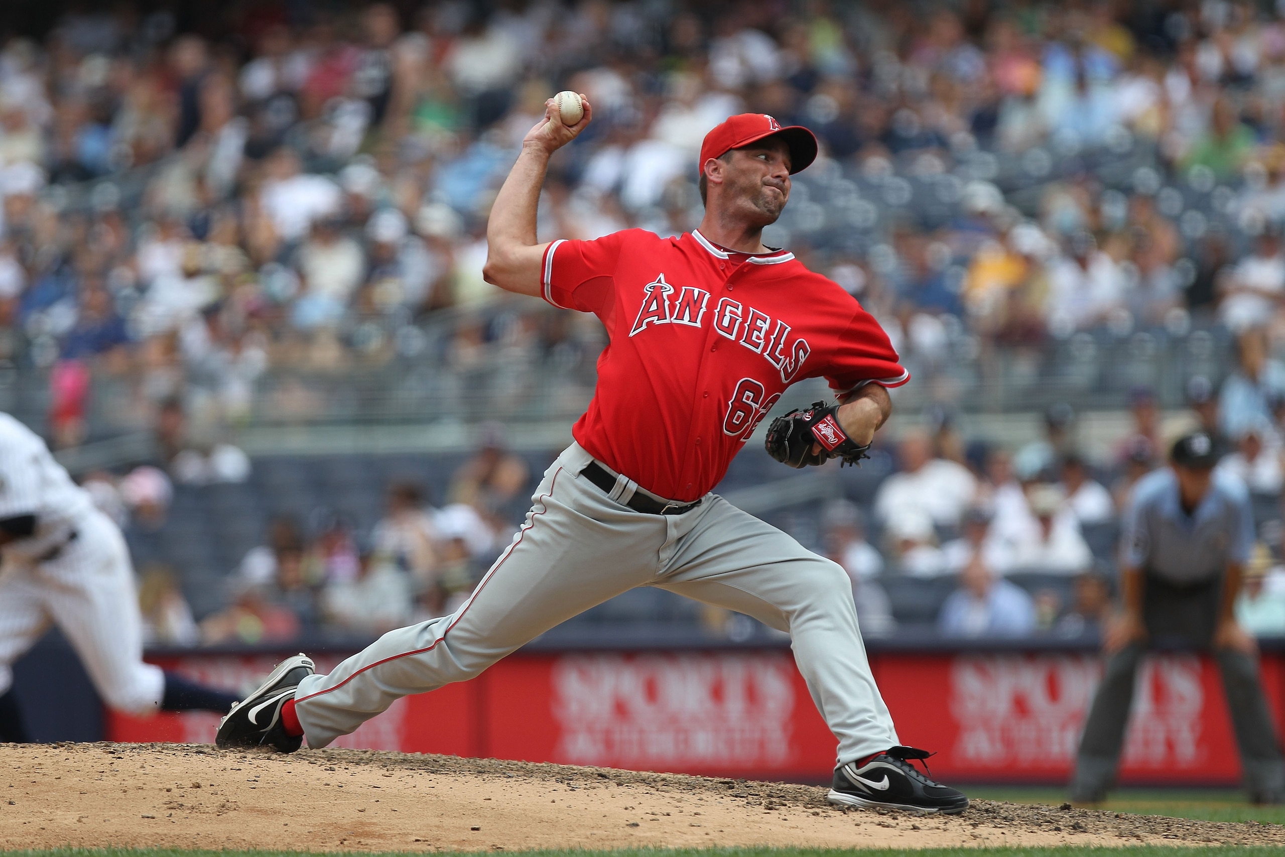 NEW YORK - JULY 21: Scot Shields #62 of the Los Angeles Angels of Anaheim pitches against the New York Yankees at Yankee Stadium on July 21, 2010 in the Bronx borough of New York City. (Photo by Nick Laham/Getty Images) NEW YORK - JULY 21: Scot Shields #62 of the Los Angeles Angels of Anaheim pitches against the New York Yankees at Yankee Stadium on July 21, 2010 in the Bronx borough of New York City. (Photo by Nick Laham/Getty Images)