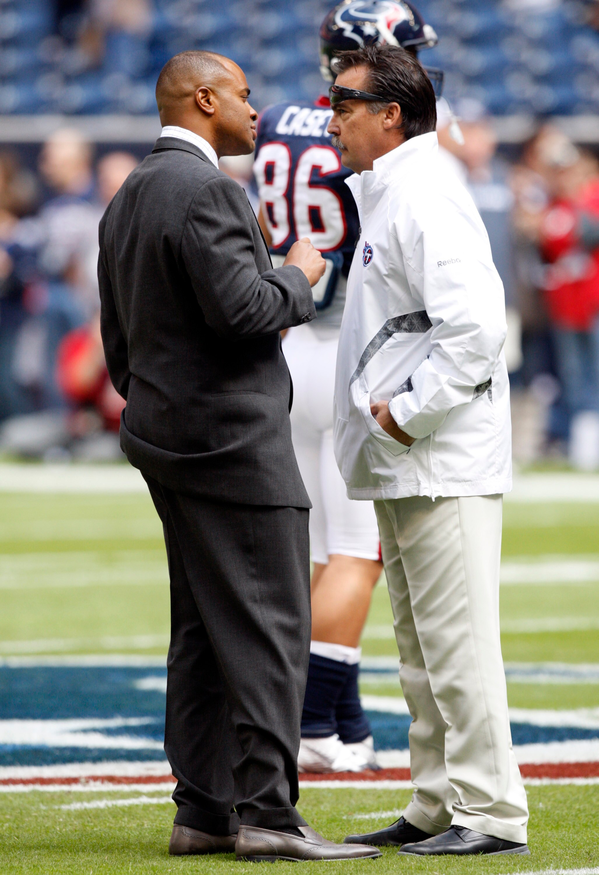 HOUSTON - NOVEMBER 28:  Rick Smith, general manager of the Houston Texans, left, talks with head coach Jeff Fisher before a football game at Reliant Stadium on November 28, 2010 in Houston, Texas.  (Photo by Bob Levey/Getty Images)