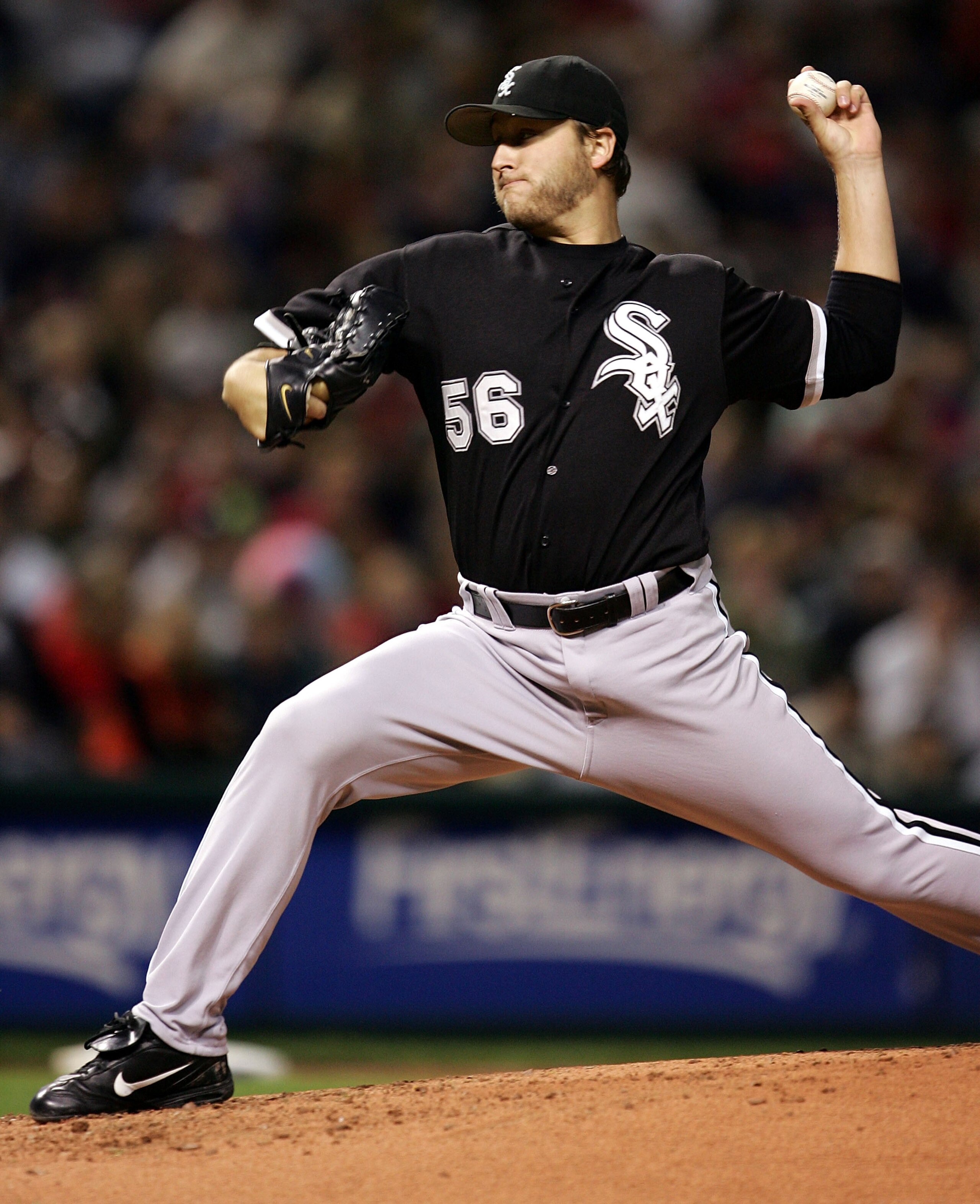 CLEVELAND - SEPTEMBER 30:  Starting pitcher Mark Buehrle #56 of the Chicago White Sox delivers the ball against the Cleveland Indians on September 30, 2005 at Jacobs Field in Cleveland, Ohio.  (Photo by Jonathan Daniel/Getty Images)