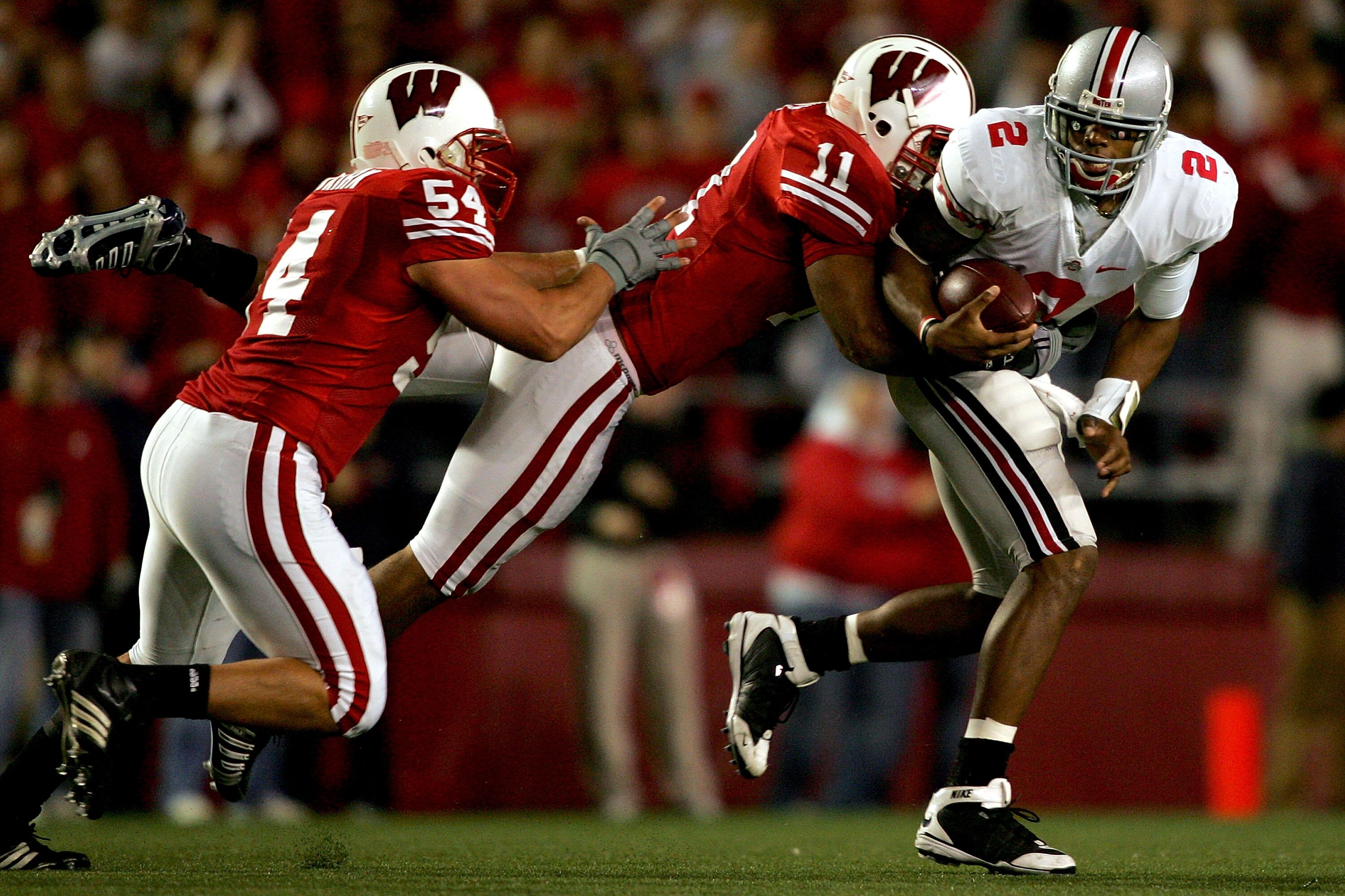 MADISON, WI - OCTOBER 04: Quarterback Terrelle Pryor #2 of the Ohio State Buckeyes is sacked by Mike Newkirk #54 and DeAndre Levy #11 of the Wisconsin Badgers at Camp Randall Stadium October 4, 2008 in Madison, Wisconsin. (Photo by Matthew Stockman/Get MADISON, WI - OCTOBER 04: Quarterback Terrelle Pryor #2 of the Ohio State Buckeyes is sacked by Mike Newkirk #54 and DeAndre Levy #11 of the Wisconsin Badgers at Camp Randall Stadium October 4, 2008 in Madison, Wisconsin. (Photo by Matthew Stockman/Get