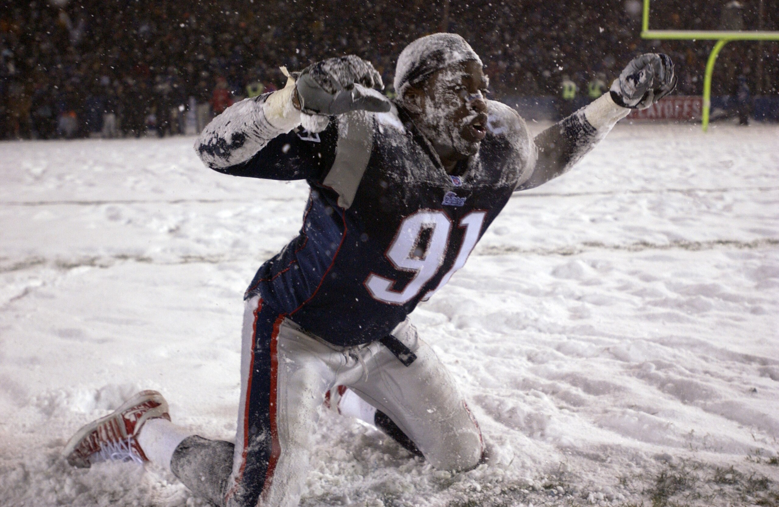 19 Jan 2002:  Bobby Hamilton #91 of the New England Patriots celebrates in the snow after a overtime win in the AFC playoff game against the Oakland Raiders at Foxboro Stadium in Foxboro, Massachuesetts. The Patriots came from behind to win 16-13 in overt