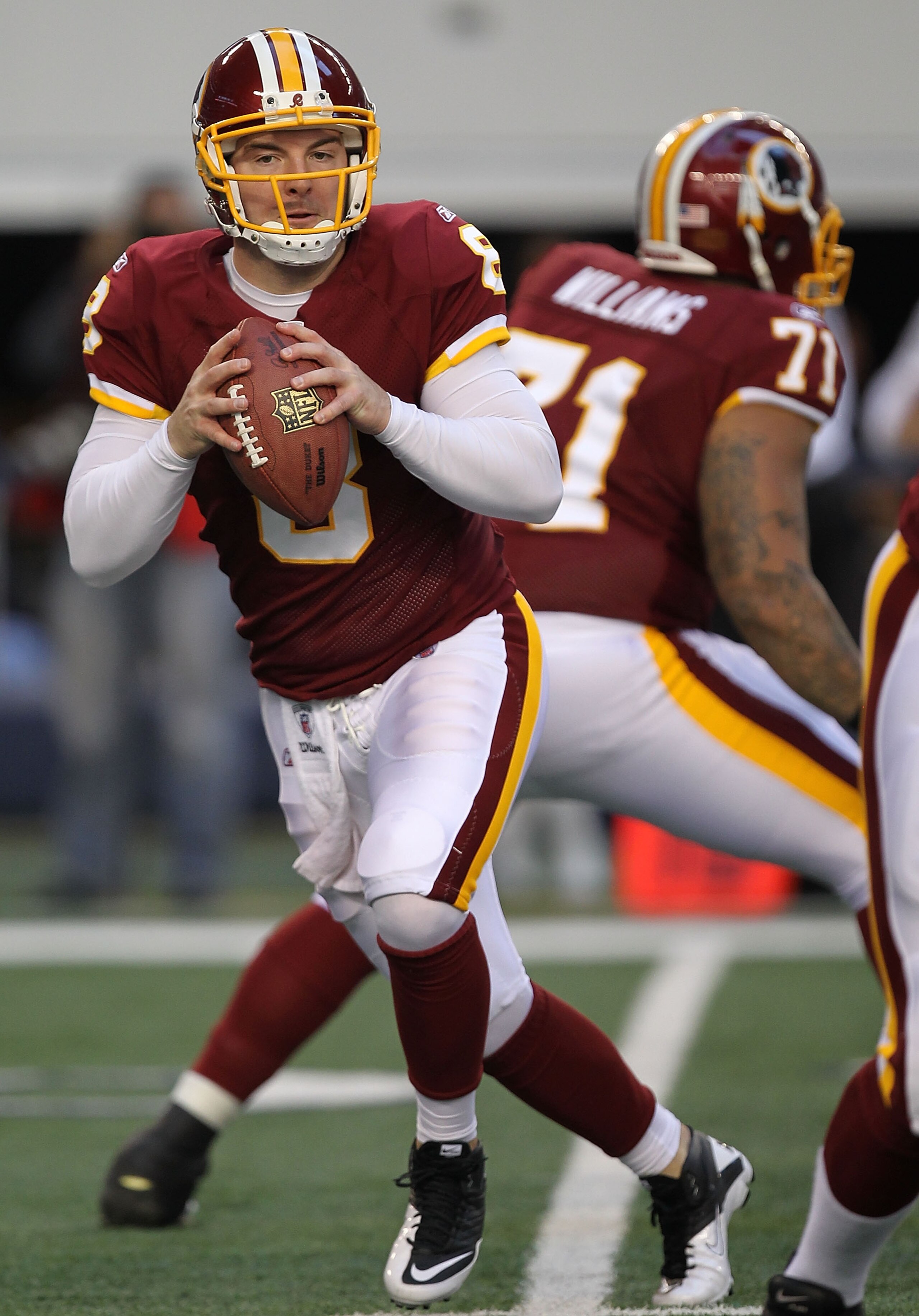 ARLINGTON, TX - DECEMBER 19:  Quarterback Rex Grossman #8 of the Washington Redskins passes against the Dallas Cowboys at Cowboys Stadium on December 19, 2010 in Arlington, Texas.  (Photo by Ronald Martinez/Getty Images)