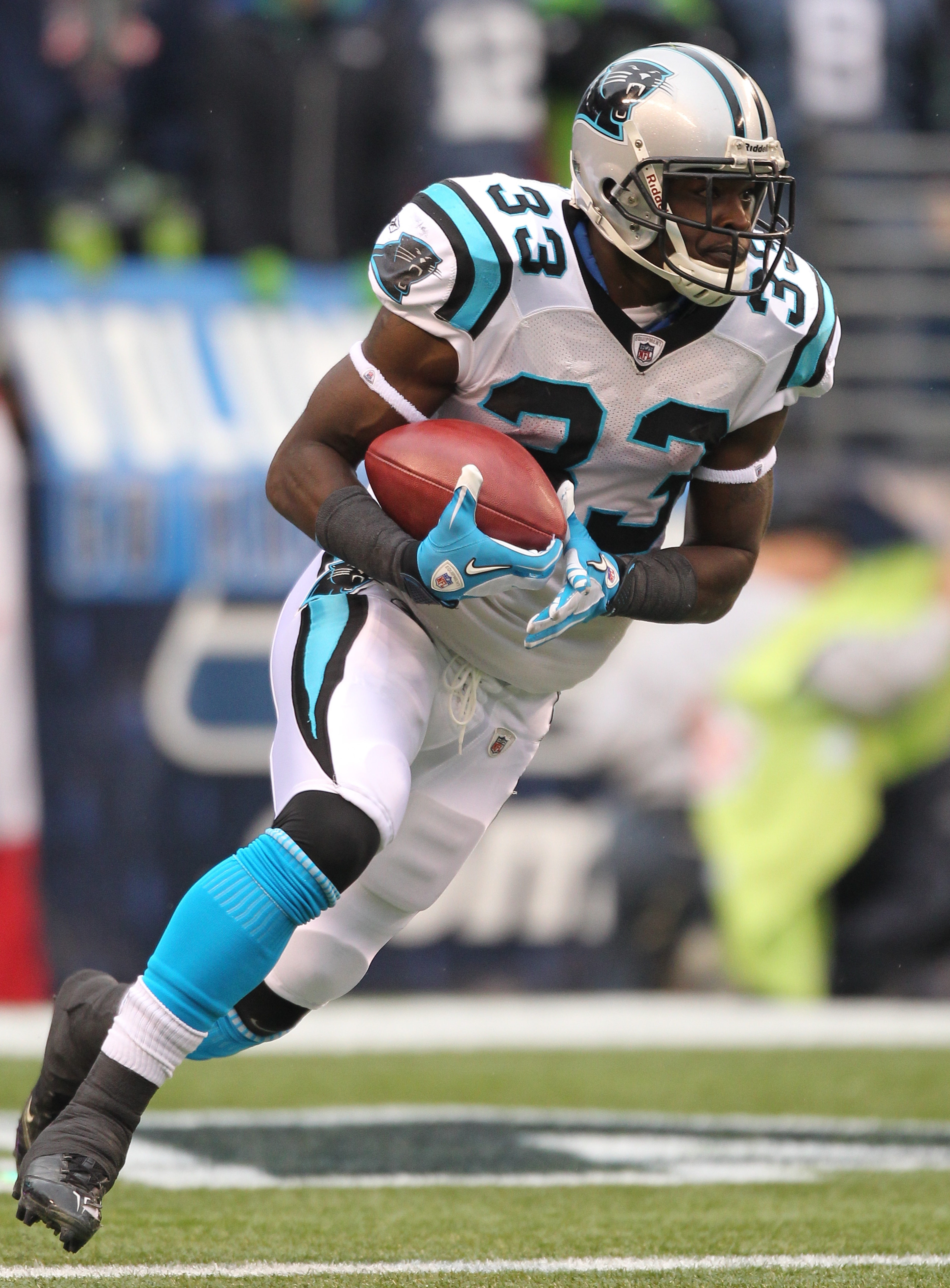 SEATTLE - DECEMBER 05:  Running back Mike Goodson #33 of the Carolina Panthers rushes against the Seattle Seahawks at Qwest Field on December 5, 2010 in Seattle, Washington. The Seahawks won, 31-14. (Photo by Otto Greule Jr/Getty Images)