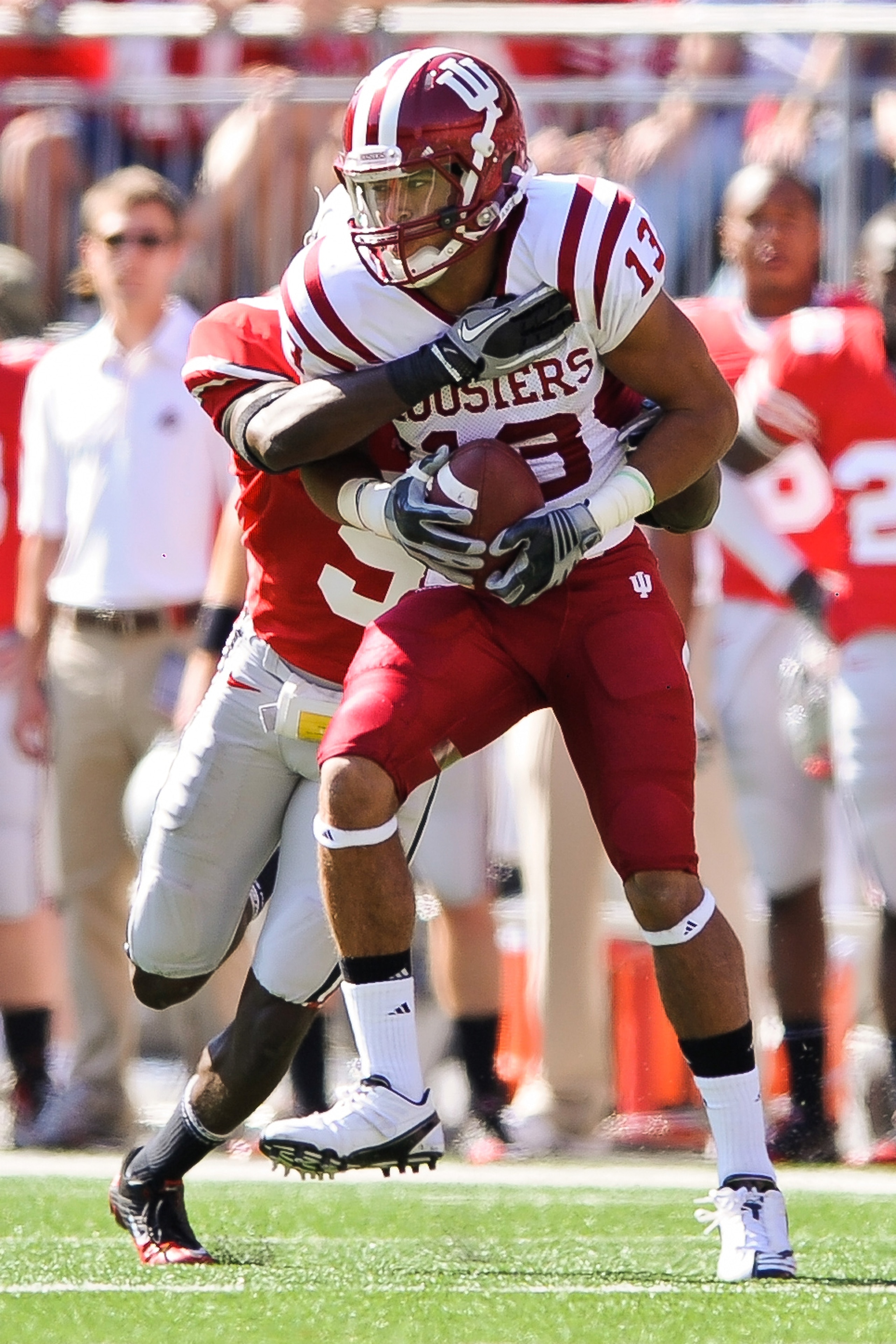 COLUMBUS, OH - OCTOBER 9:  Kofi Hughes #13 of the Indiana Hoosiers runs with the ball after making a catch against the Ohio State Buckeyes at Ohio Stadium on October 9, 2010 in Columbus, Ohio.  (Photo by Jamie Sabau/Getty Images)