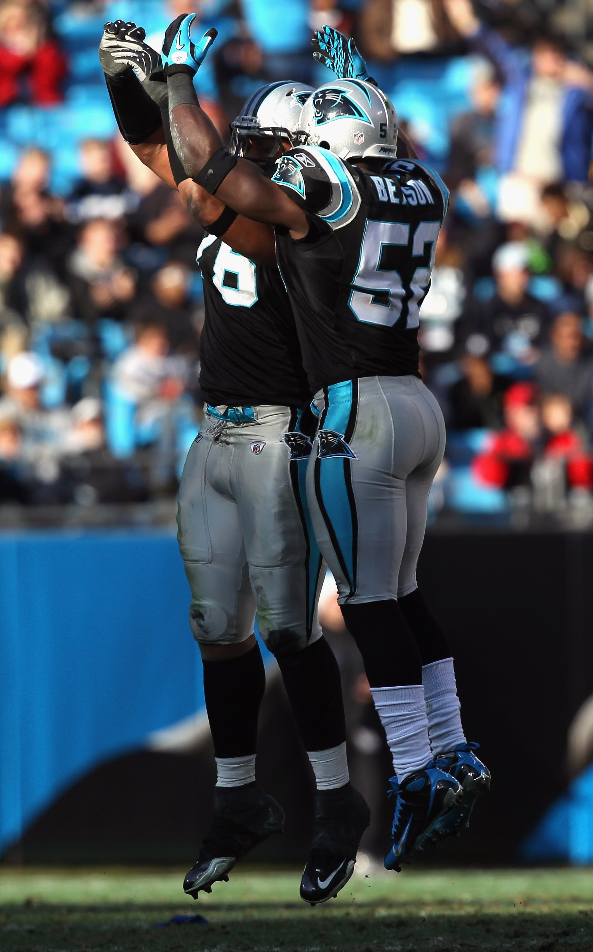 CHARLOTTE, NC - DECEMBER 19:  Teammates Jon Beason #52 and Greg Hardy of the Carolina Panthers celebrate after a defensive stop during their game against the Arizona Cardinals at Bank of America Stadium on December 19, 2010 in Charlotte, North Carolina.