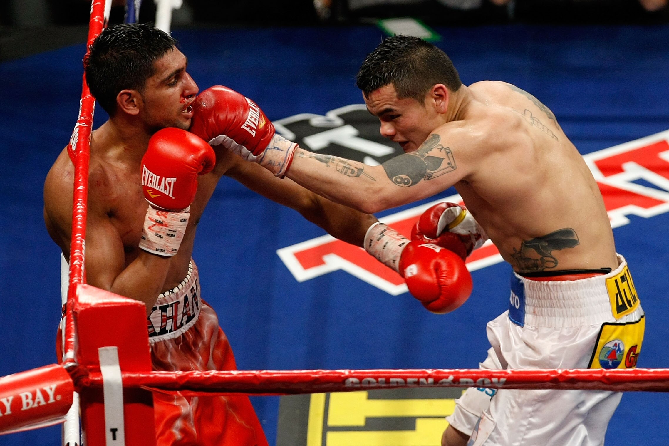 LAS VEGAS - DECEMBER 11:  (R-L) Marcos Maidana of Argentina connects with a left at Amir Khan of England during the WBA super lightweight title fight at Mandalay Bay Events Center on December 11, 2010 in Las Vegas, Nevada.  (Photo by Ethan Miller/Getty Im