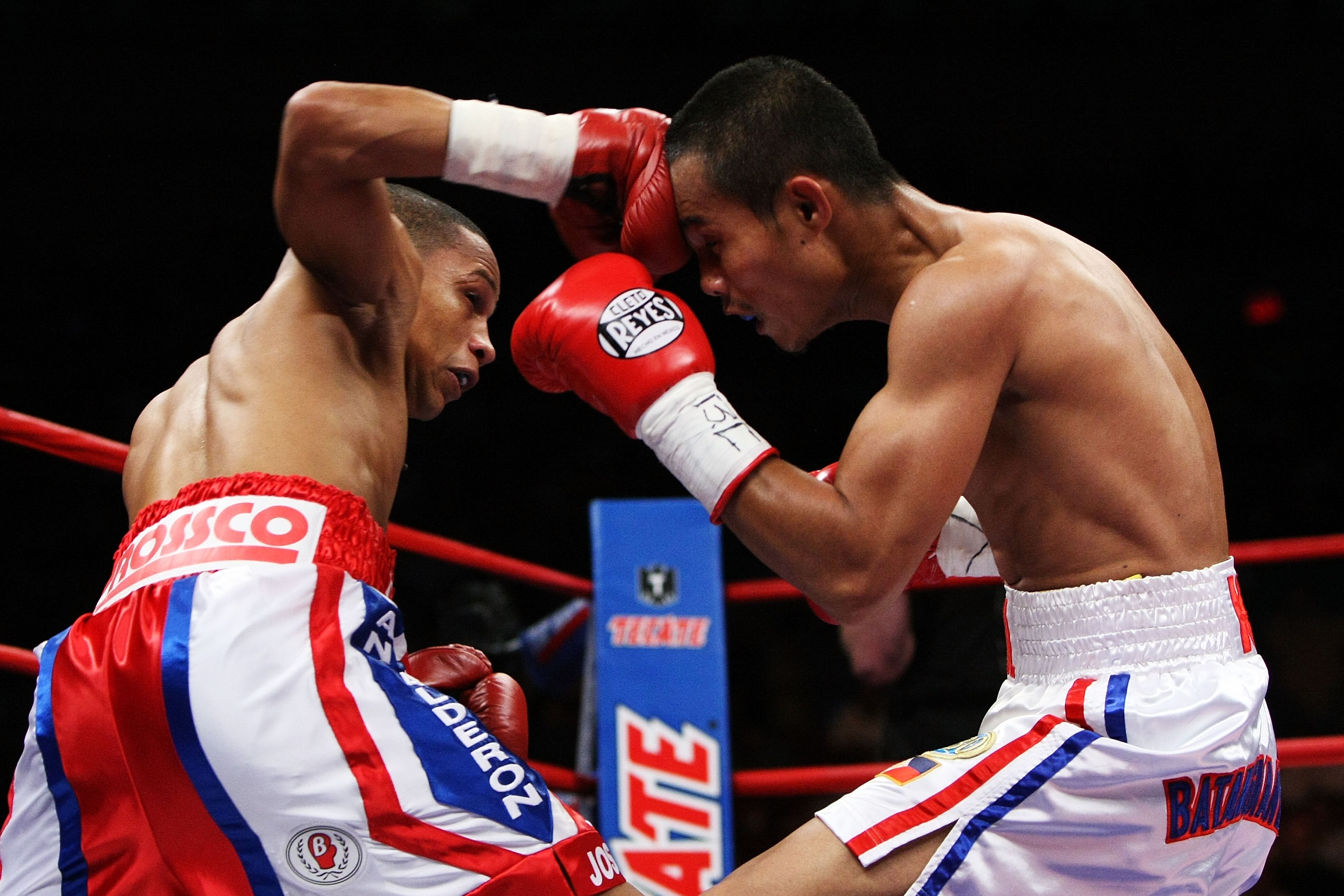 NEW YORK - JUNE 13:  Ivan Calderon punches Rodel Mayol during their WBO Mini Flyweight title fight at Madison Square Garden on June 13, 2009 in New York City.   (Photo by Al Bello/Getty Images)
