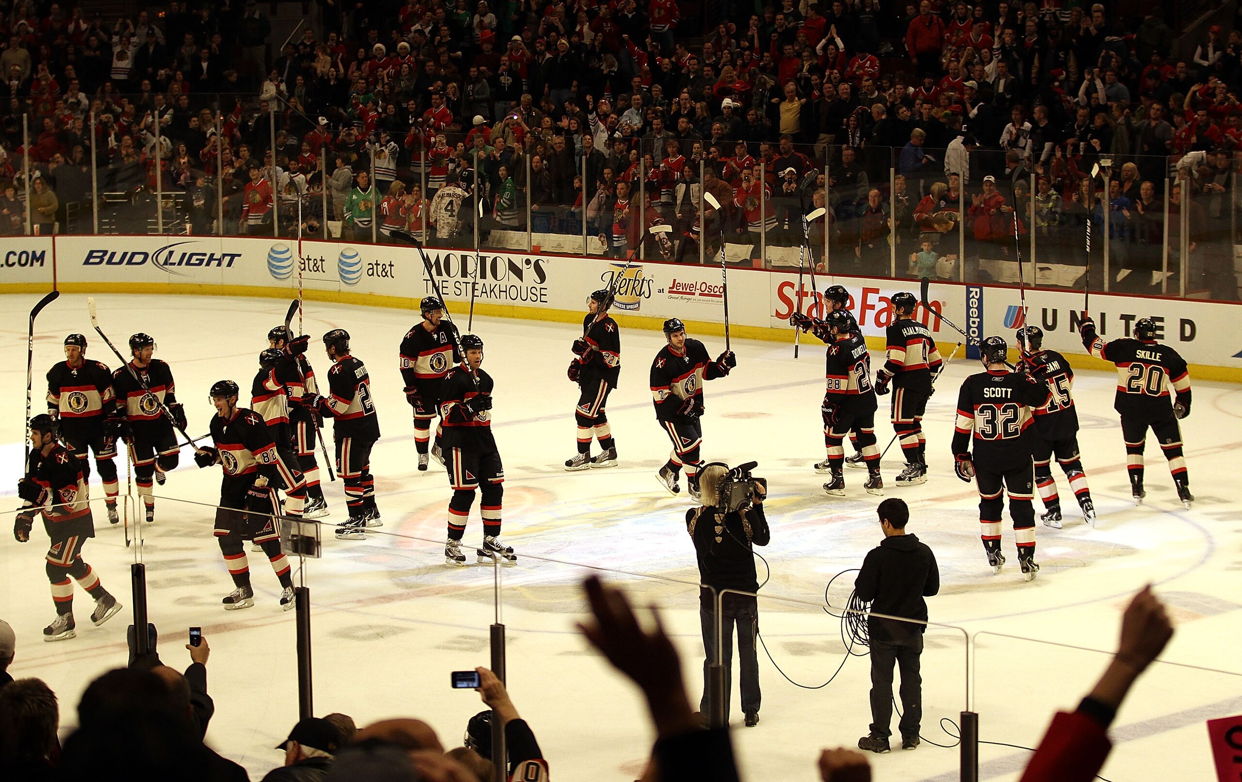 CHICAGO, IL - DECEMBER 22: Members of the Chicago Blackhawks salute the crowd after a win over the Nashville Predators at the United Center on December 22, 2010 in Chicago, Illinois. The Blackhawks defeated the Predators 4-1. (Photo by Jonathan Daniel/Get