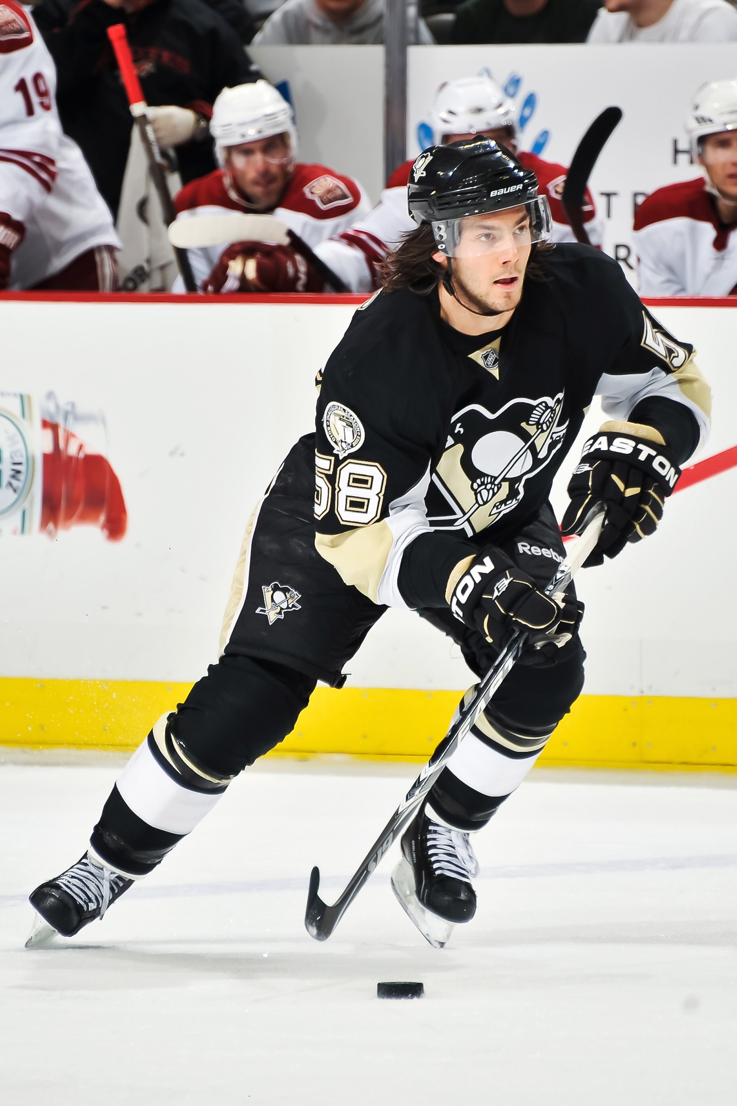 PITTSBURGH, PA - DECEMBER 20:  Kris Letang #58 of the Pittsburgh Penguins skates with the puck against the Phoenix Coyotes on December 20, 2010 at CONSOL Energy Center in Pittsburgh, Pennsylvania.  (Photo by Jamie Sabau/Getty Images)
