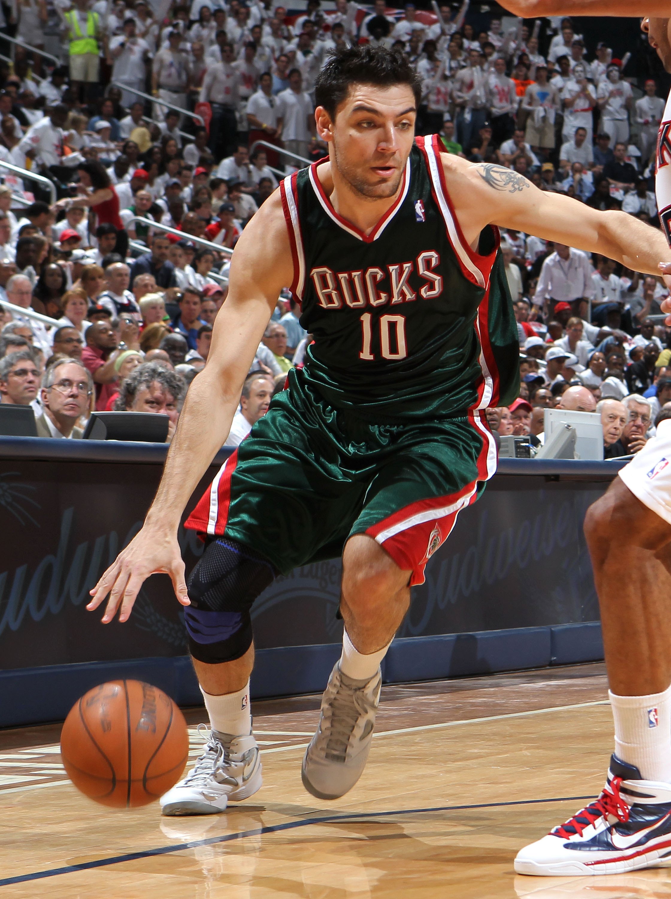 ATLANTA - MAY 2:  Forward Carlos Delfino #10 of the Milwaukee Bucks dribbles with the ball during Game Seven of the Eastern Conference Quarterfinals between the Milwaukee Bucks and the Atlanta Hawks during the 2010 NBA Playoffs at Philips Arena on May 2,