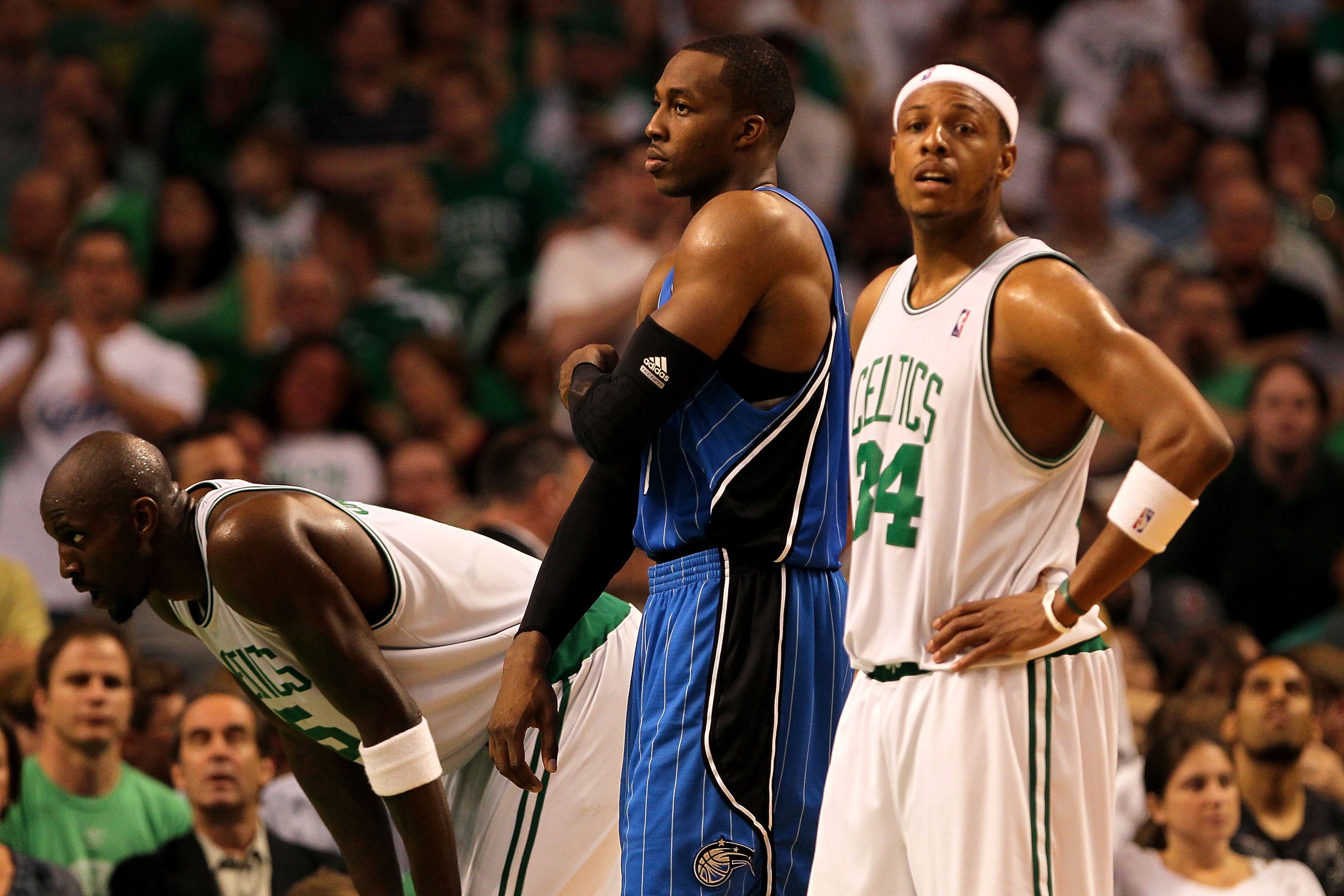 BOSTON - MAY 24:  Kevin Garnett #5 and Paul Pierce #34 of the Boston Celtics stand and wait for a free throw attemp against Dwight Howard #12 (C) of the Orlando Magic in Game Four of the Eastern Conference Finals during the 2010 NBA Playoffs at TD Banknor