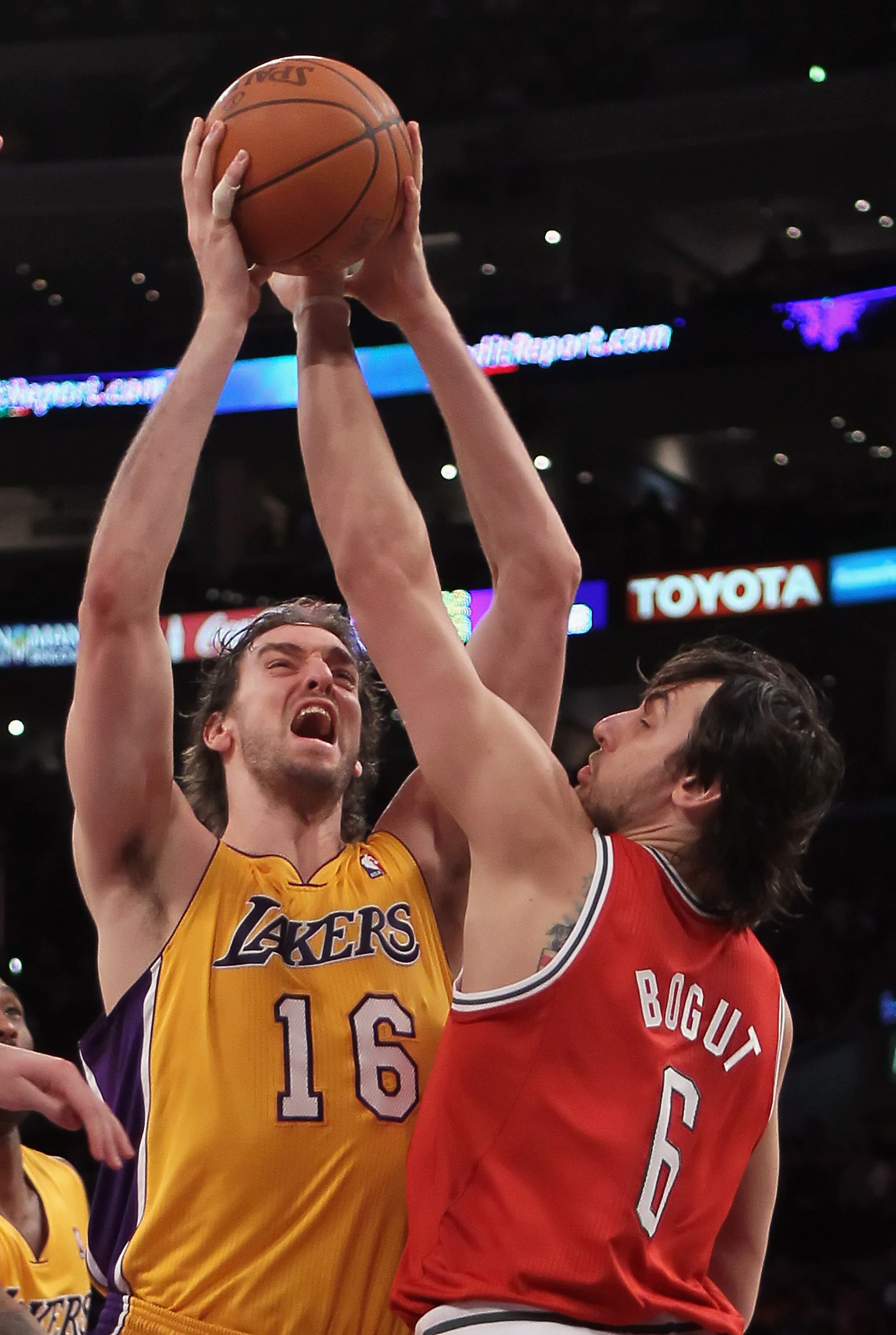 LOS ANGELES, CA - DECEMBER 21:  Pau Gasol #16 of the Los Angeles Lakers is defended by Andrew Bogut #6 of the Milwaukee Bucks during the first half at Staples Center on December 21, 2010 in Los Angeles, California. The Bucks defeated the Lakers 98-79. NOT