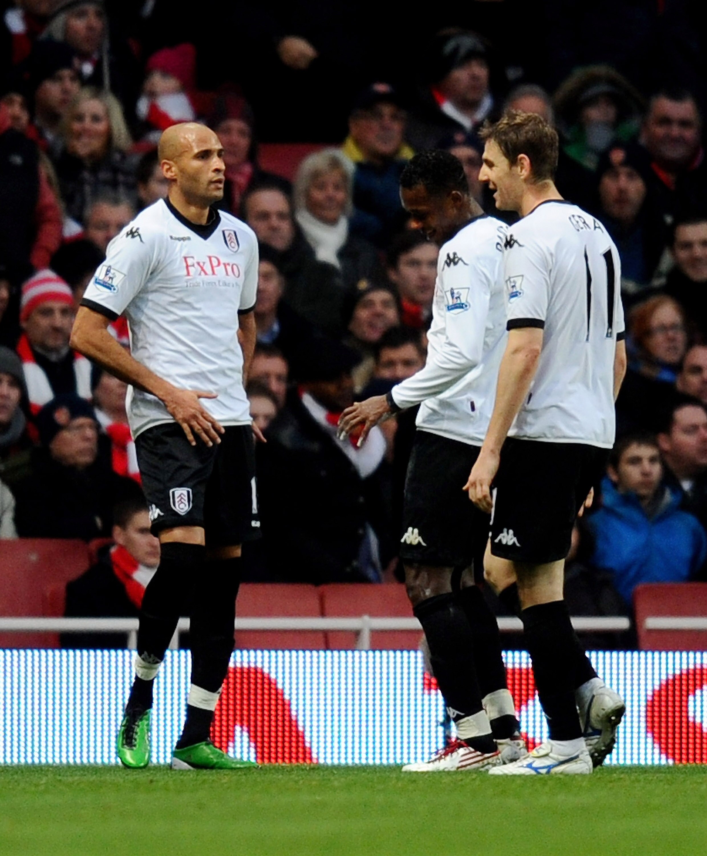 LONDON, ENGLAND - DECEMBER 04:  Diomansy Kamara (L) of Fulham celebrates scoring the equalising goal during the Barclays Premier League match between Arsenal and Fulham at the Emirates Stadium on December 4, 2010 in London, England.  (Photo by Mike Hewitt