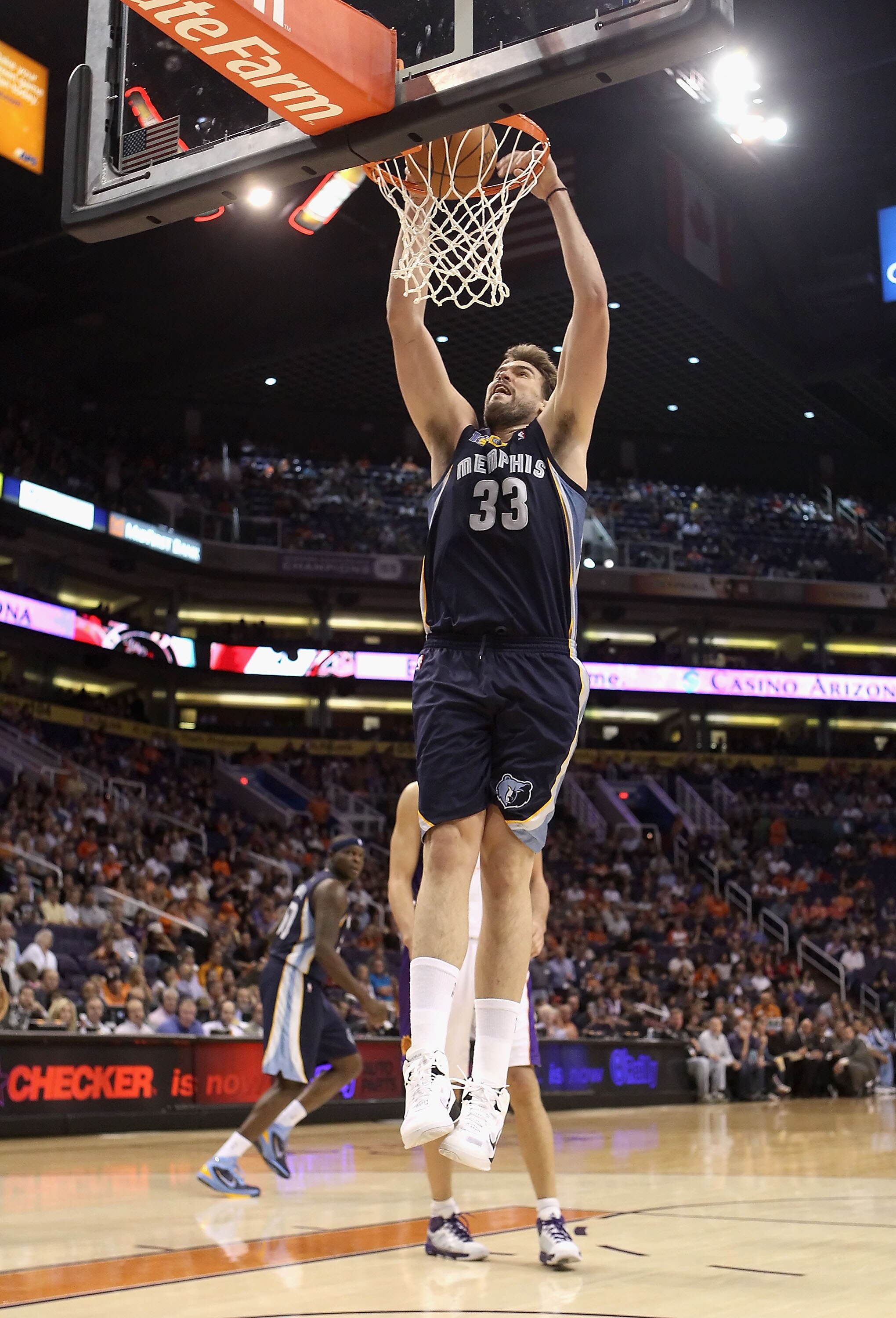 PHOENIX - NOVEMBER 05:  Marc Gasol #33 of the Memphis Grizzlies slam dunks during the NBA game against the Phoenix Suns at US Airways Center on November 5, 2010 in Phoenix, Arizona. NOTE TO USER: User expressly acknowledges and agrees that, by downloading