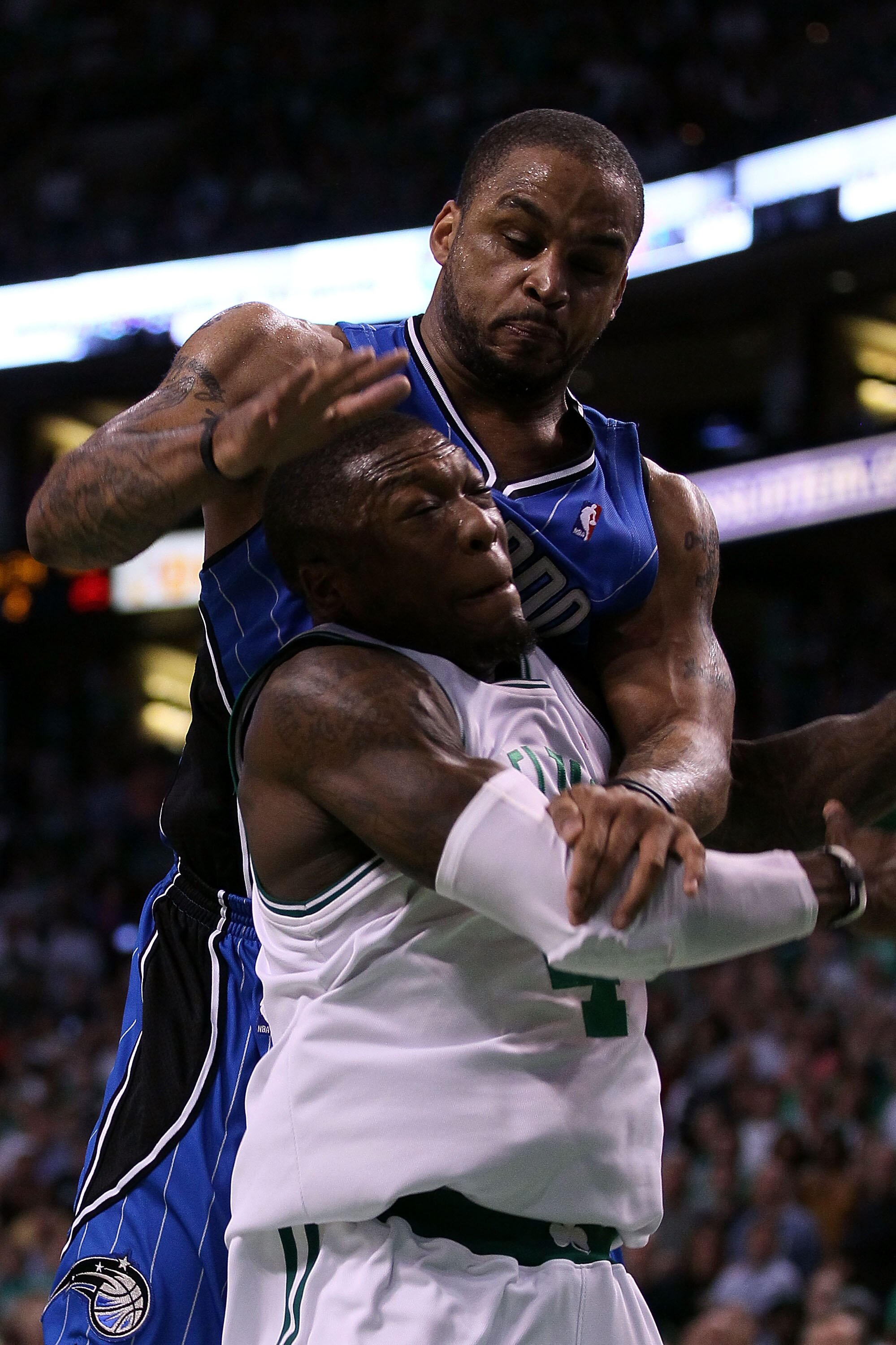 BOSTON - MAY 28:  Nate Robinson #4 of the Boston Celtics is fouled by Jameer Nelson #14 of the Orlando Magic in Game Six of the Eastern Conference Finals during the 2010 NBA Playoffs at TD Garden on May 28, 2010 in Boston, Massachusetts.  NOTE TO USER: Us