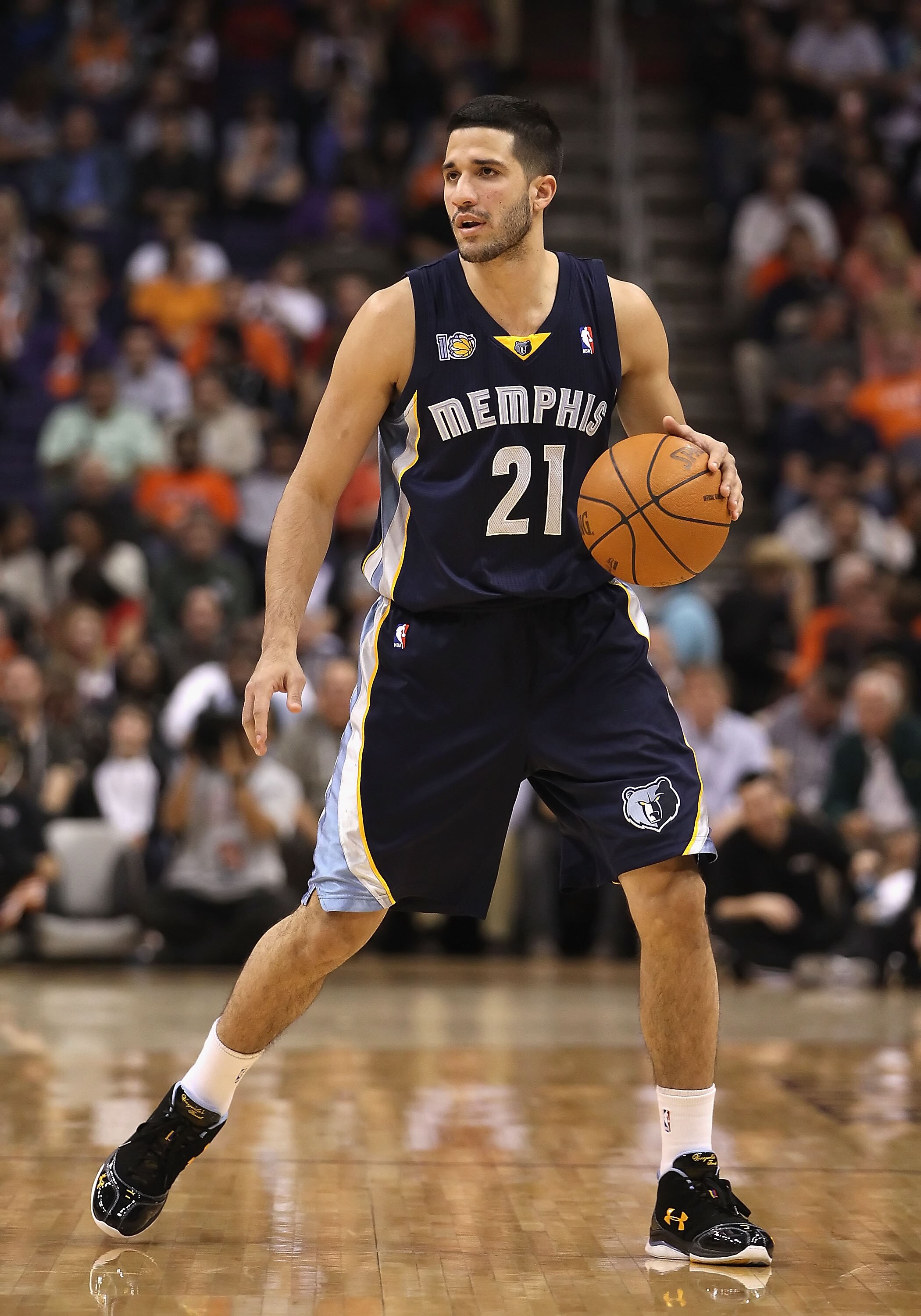 PHOENIX - DECEMBER 08:  Greivis Vasquez #21 of the Memphis Grizzlies handles the ball against the Phoenix Suns during the NBA game at US Airways Center on December 8, 2010 in Phoenix, Arizona. NOTE TO USER: User expressly acknowledges and agrees that, by