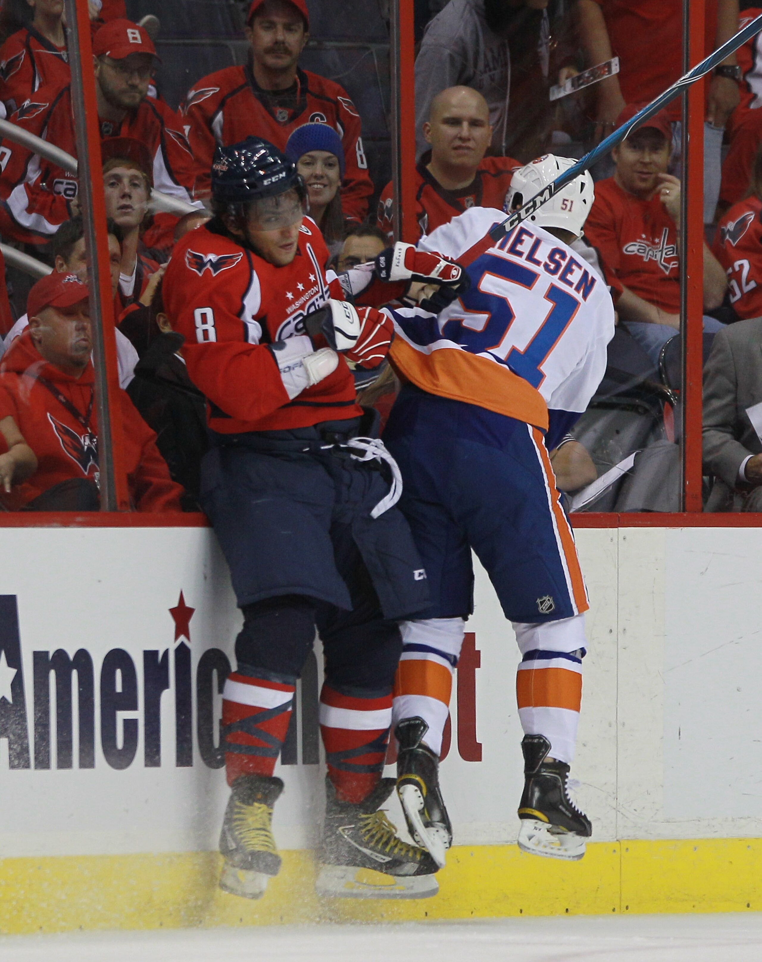 WASHINGTON - OCTOBER 13:  Alex Ovechkin #8 of the Washington Capitals is hit byFrans Nielsen #51 of the New York Islanders at the Verizon Center on October 13, 2010 in Washington, DC.  (Photo by Bruce Bennett/Getty Images)