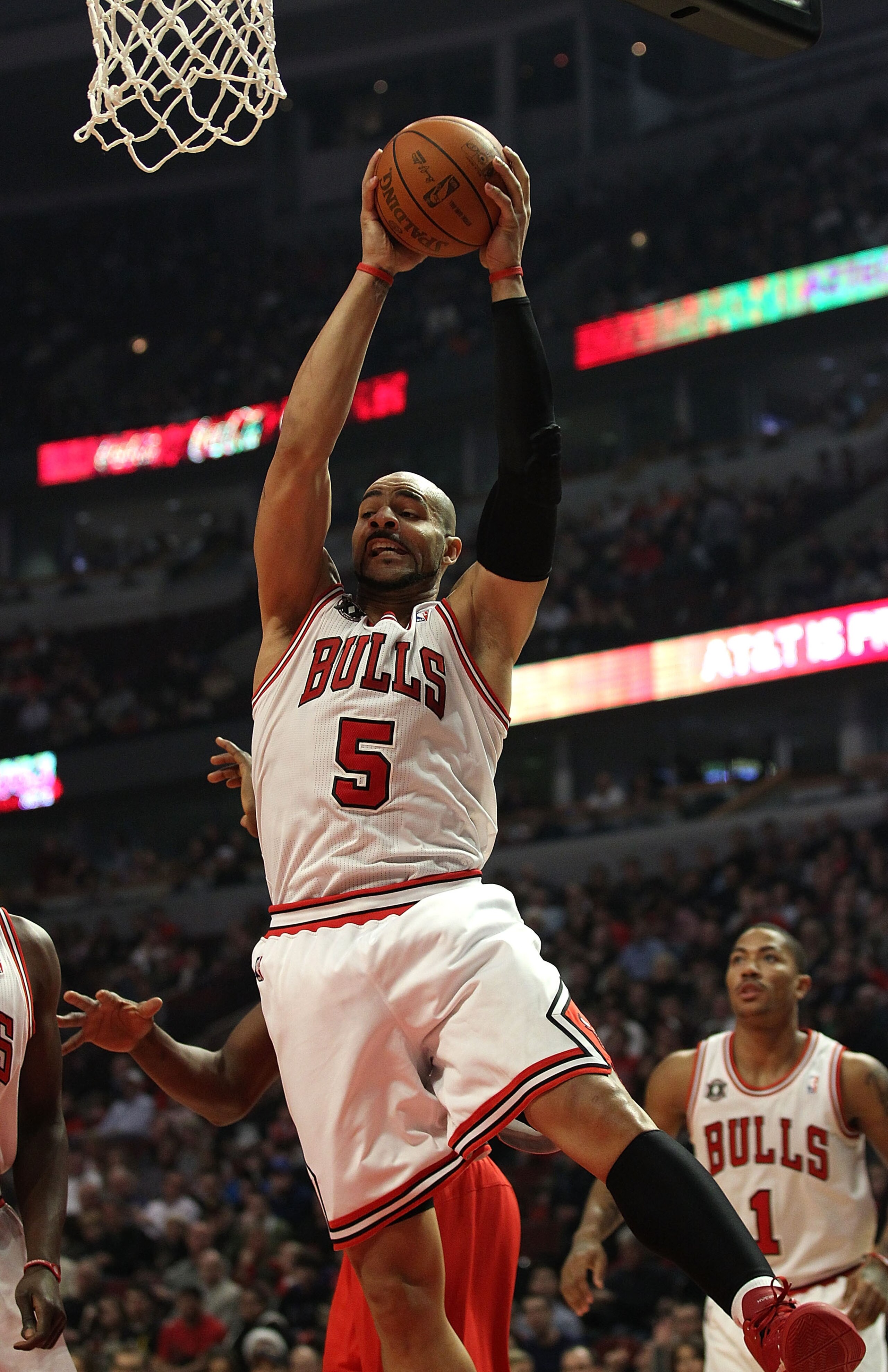 CHICAGO, IL - DECEMBER 21: Carlos Boozer #5 of the Chicago Bulls grabs a rebound against the Philadelphia 76ers at the United Center on December 21, 2010 in Chicago, Illinois. NOTE TO USER: User expressly acknowledges and agrees that, by downloading and/o