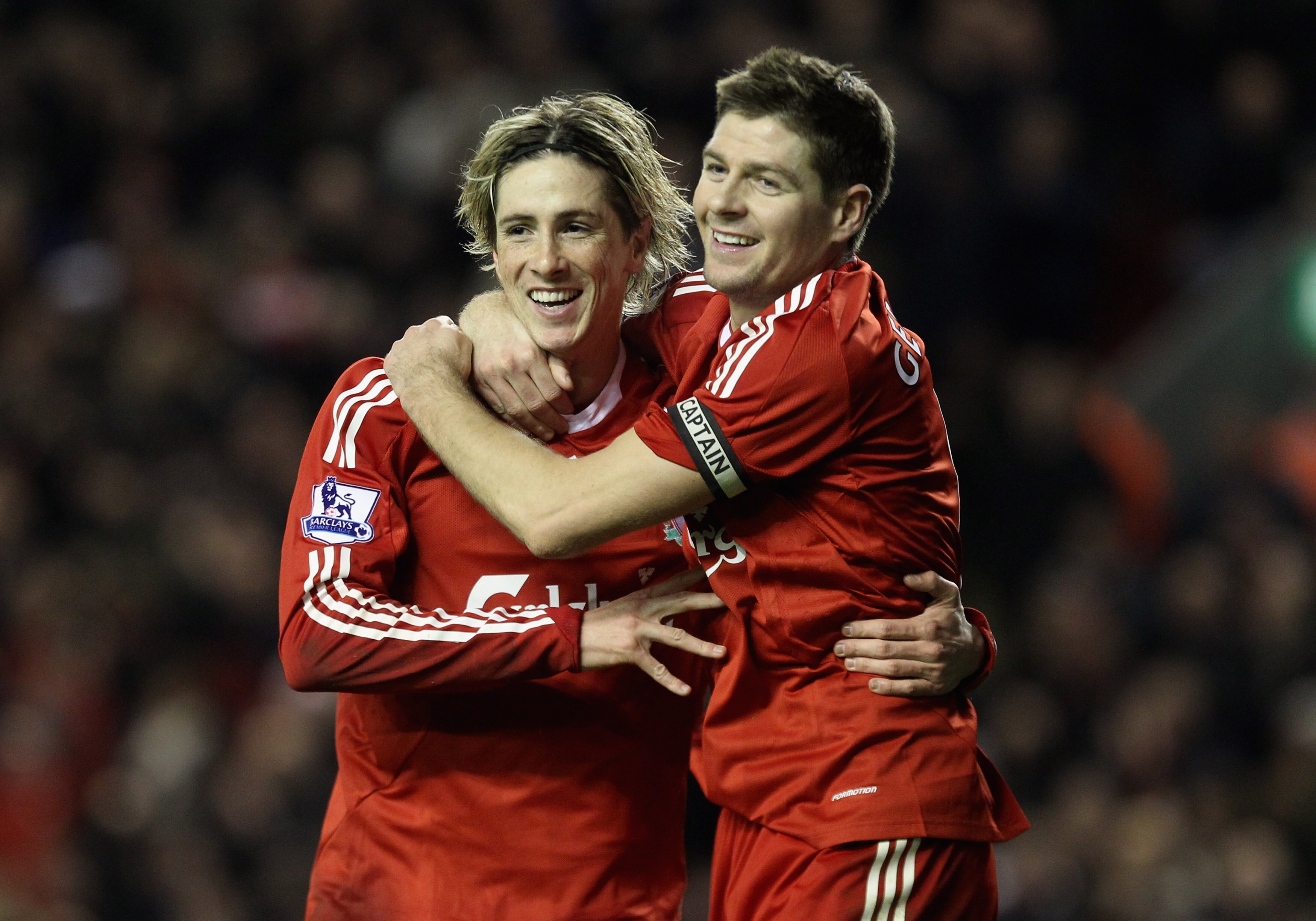 LIVERPOOL, ENGLAND - DECEMBER 16:   Fernando Torres of Liverpool is congratulated by team mate Steven Gerrard (R) after scoring his team's second goal during the Barclays Premier League match between Liverpool and Wigan Athletic at Anfield on December 16,