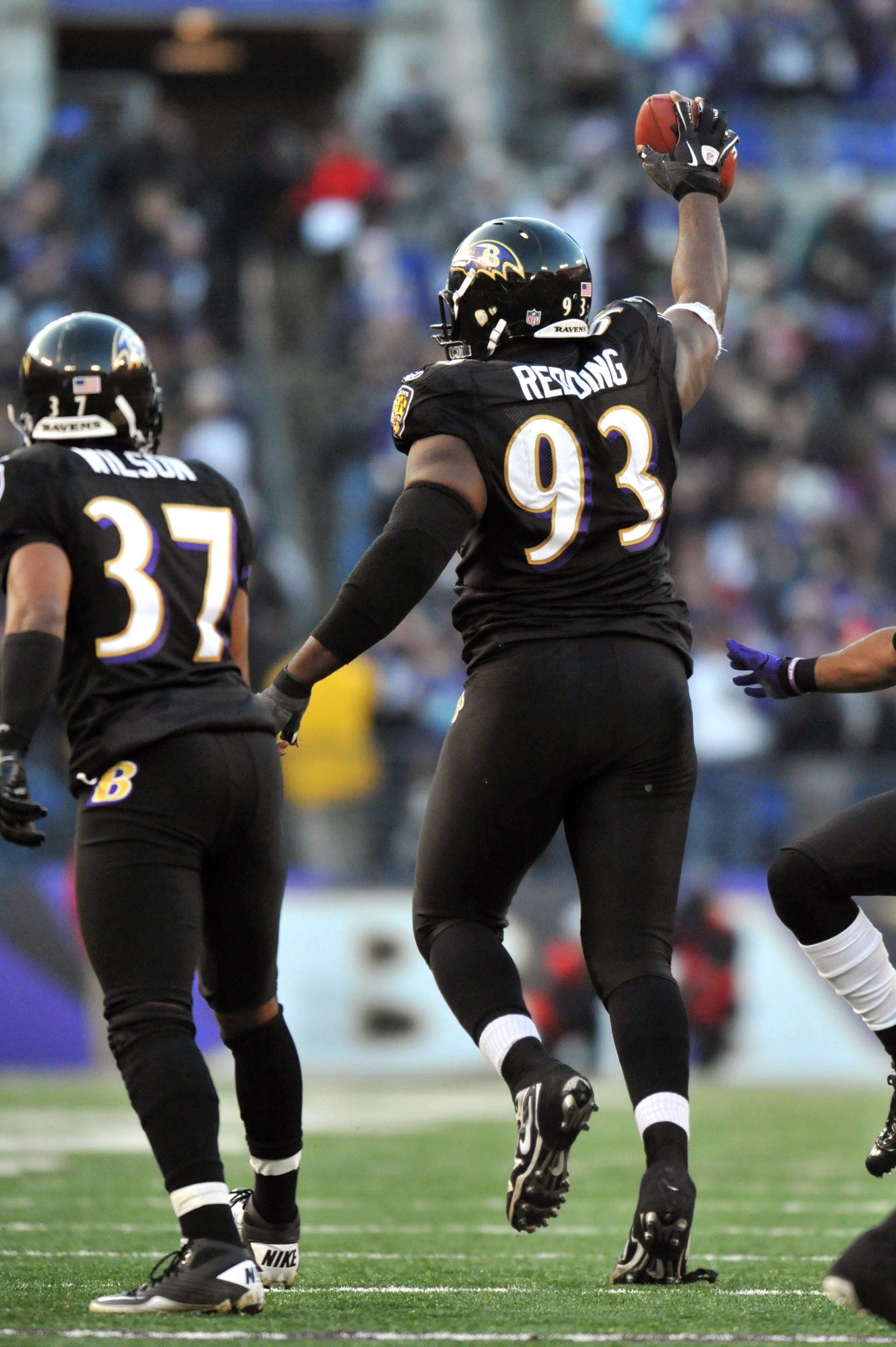 BALTIMORE, MD - DECEMBER 19:  Cory Redding #93 of the Baltimore Ravens celebrates his interception with 1 minute, 56 seconds to go in the game against the New Orleans Saints  at M&T Bank Stadium on December 19, 2010 in Baltimore, Maryland. The Ravens defe