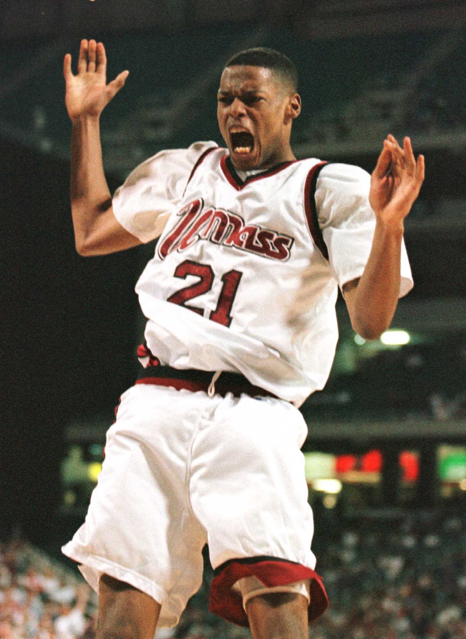 23 Mar 1996: Center Marcus Camby of the UMass Minutemen celebrates after finishing off a dunk in the second half of the Minutemen''s 86-62 NCAA East Regional Championship victory over the Georgetown Hoyas at Georgia Dome in Atlanta, Georgia.
