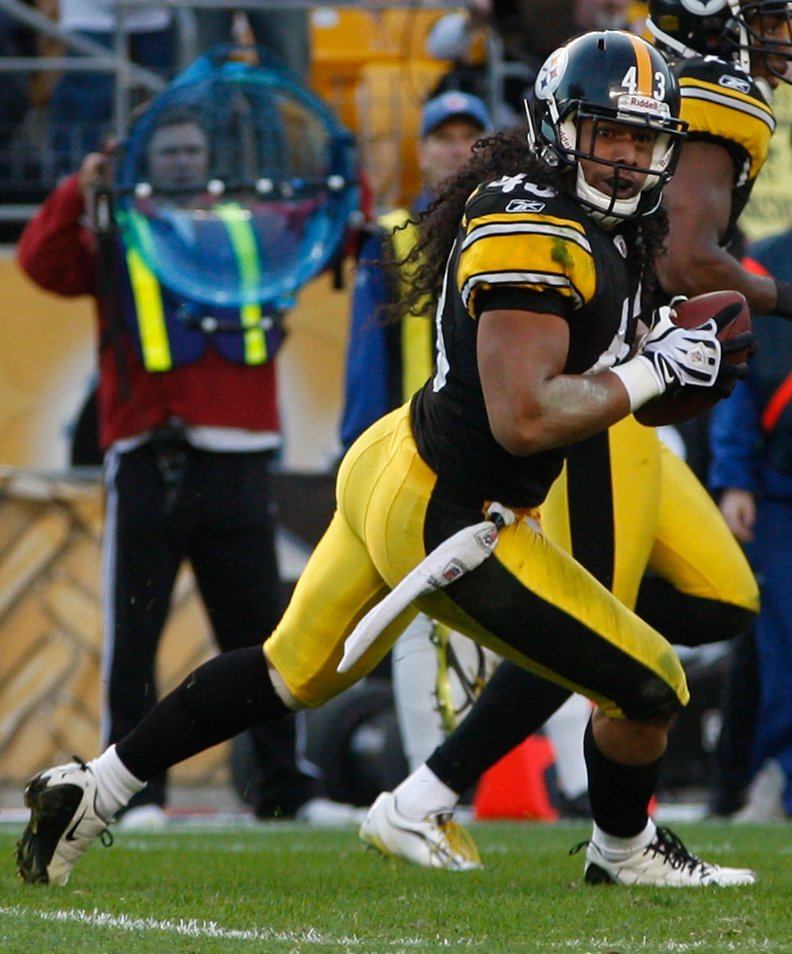 PITTSBURGH - NOVEMBER 21:  Troy Polamalu #43 of the Pittsburgh Steelers runs with the ball after catching an interception against the Oakland Raiders during the game on November 21, 2010 at Heinz Field in Pittsburgh, Pennsylvania.  (Photo by Jared Wickerh