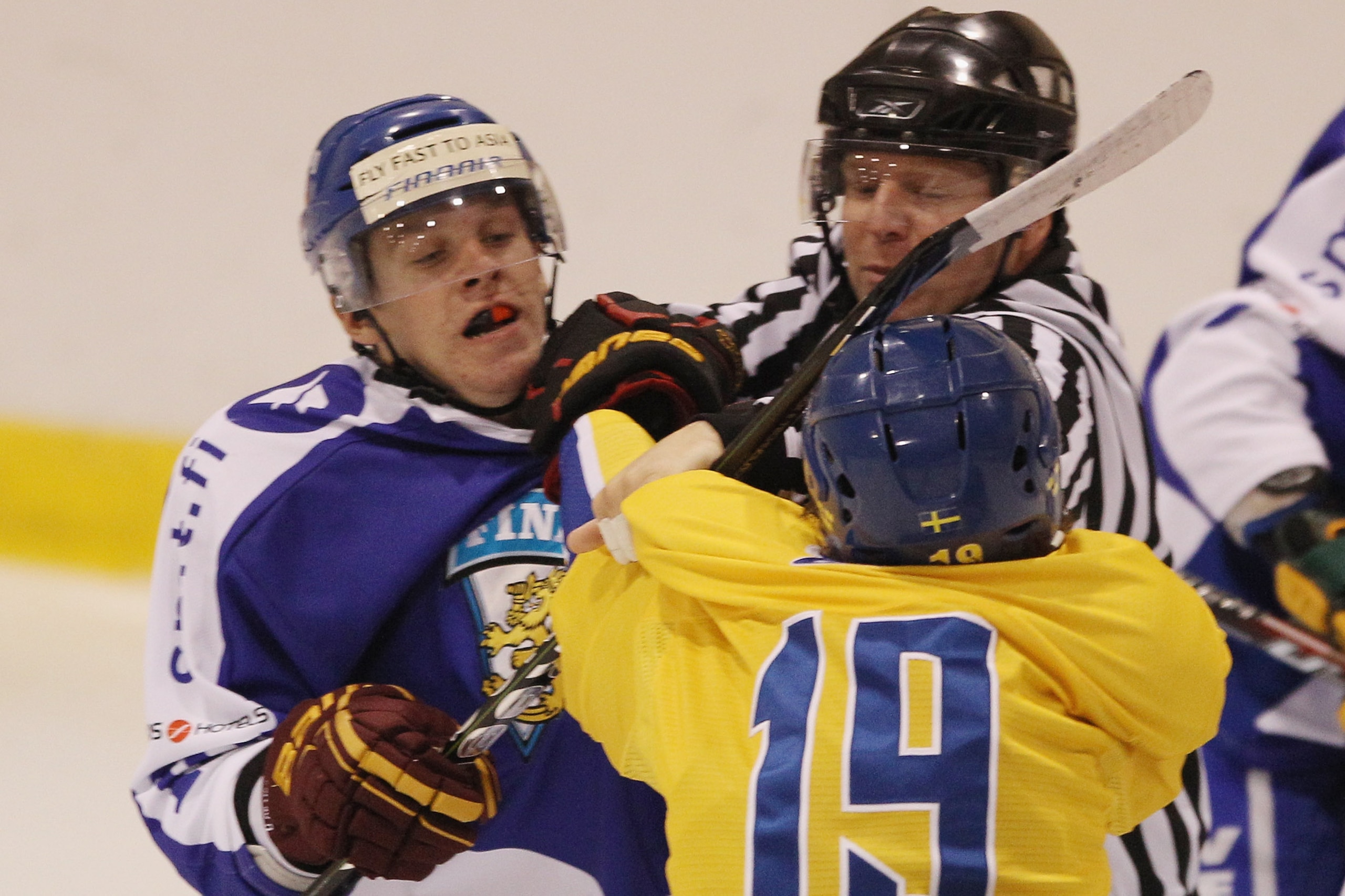 LAKE PLACID, NY - AUGUST 05: Erik Haula #10 of Team Finland is hit by Calle Jarnkrok #19 of Team Sweden at the USA Hockey National Evaluation Camp on August 5, 2010 in Lake Placid, New York.  (Photo by Bruce Bennett/Getty Images)