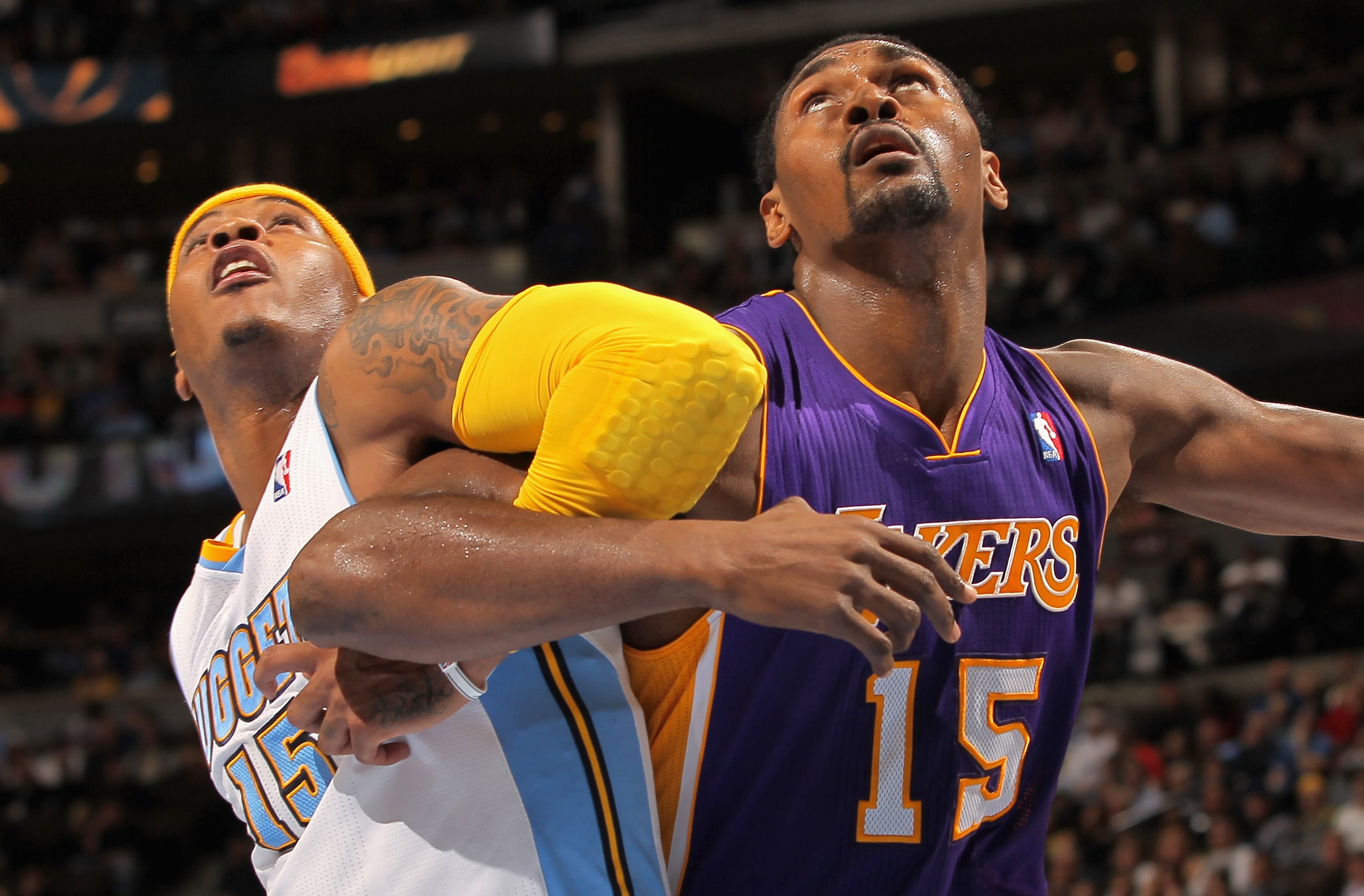 DENVER - NOVEMBER 11: Ron Artest #15 of the Los Angeles Lakers battles for position with Carmelo Anthony #15 of the Denver Nuggets at the Pepsi Center on November 11, 2010 in Denver, Colorado. The Nuggets defeated the Lakers 118-112. NOTE TO USER: User DENVER - NOVEMBER 11: Ron Artest #15 of the Los Angeles Lakers battles for position with Carmelo Anthony #15 of the Denver Nuggets at the Pepsi Center on November 11, 2010 in Denver, Colorado. The Nuggets defeated the Lakers 118-112. NOTE TO USER: User