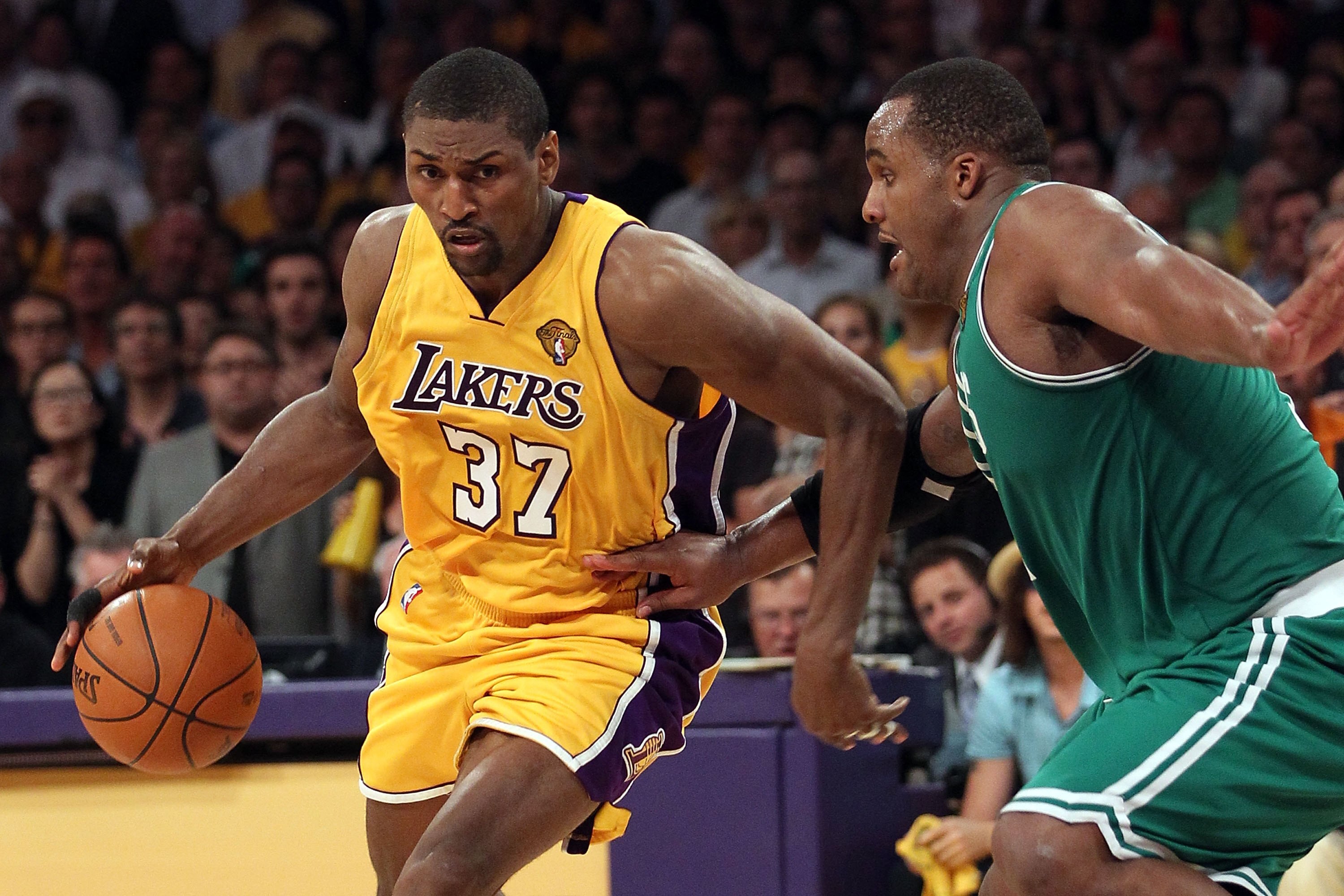 LOS ANGELES, CA - JUNE 17:  Ron Artest #37 of the Los Angeles Lakers drives on Glen Davis #11 of the Boston Celtics in Game Seven of the 2010 NBA Finals at Staples Center on June 17, 2010 in Los Angeles, California.  NOTE TO USER: User expressly acknowled