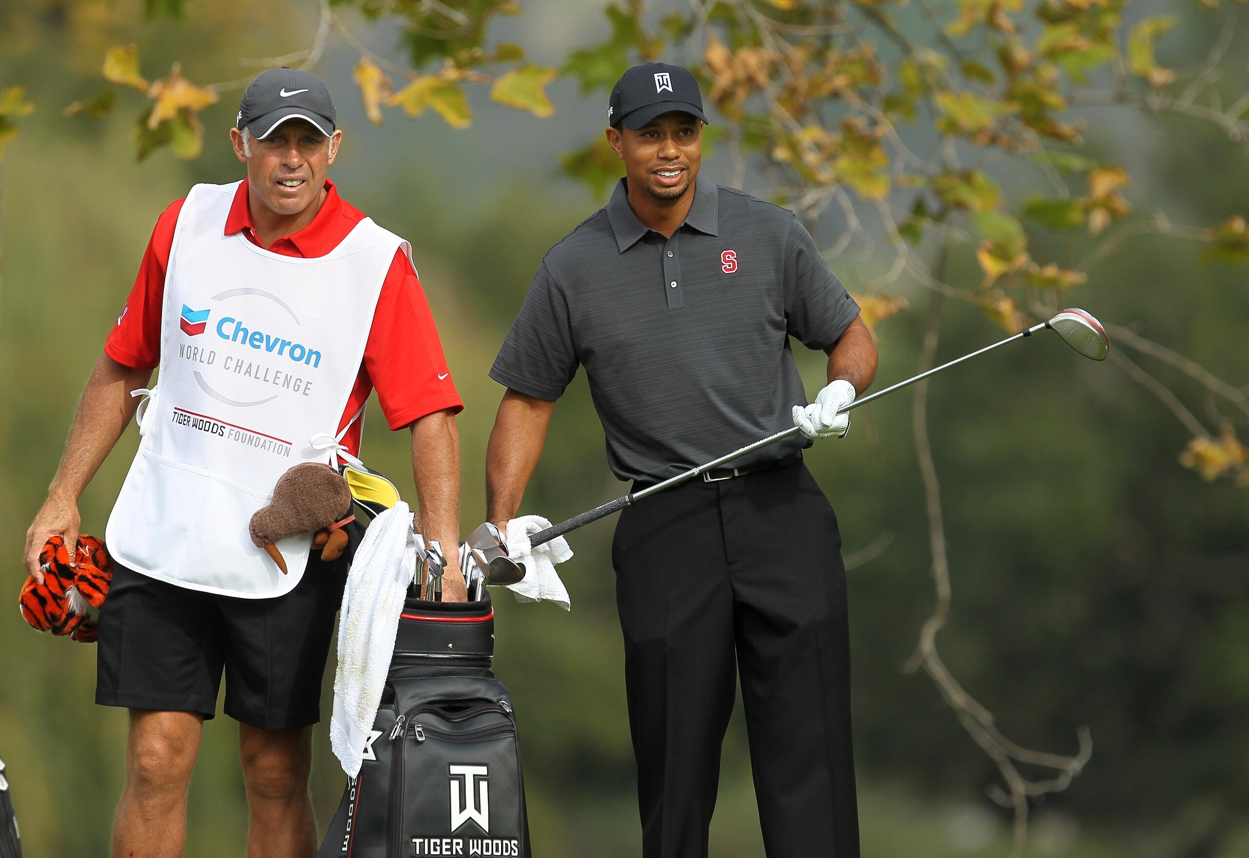 THOUSAND OAKS, CA - DECEMBER 03:  Tiger Woods and caddie Steve Williams talk over Woods' tee shot on the fifth hole during round two of the Chevron World Challenge at Sherwood Country Club on December 3, 2010 in Thousand Oaks, California.  (Photo by Steph