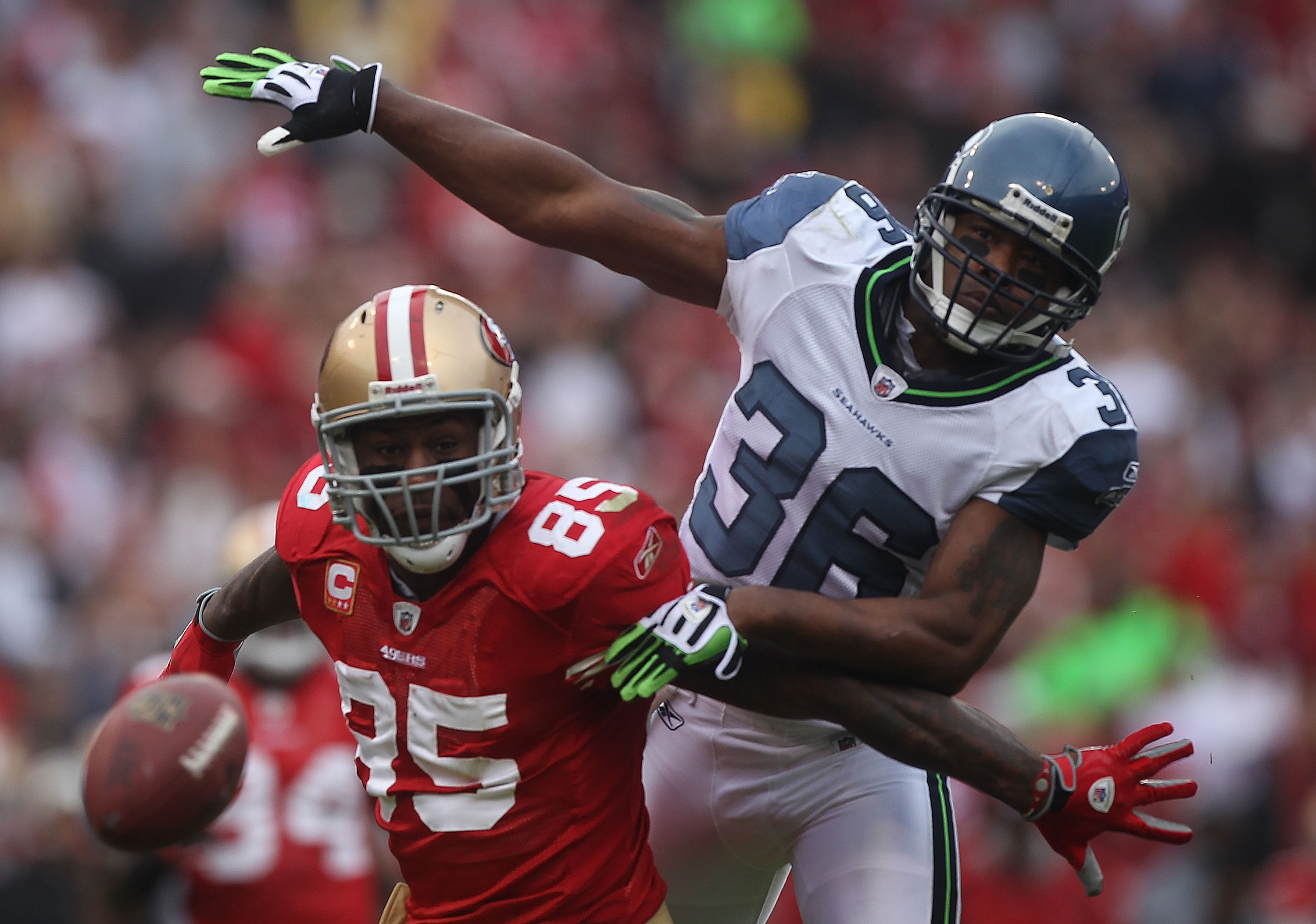 SAN FRANCISCO - DECEMBER 12:  Vernon Davis #85 of the San Francisco 49ers can't reach a pass as Lawyer Milloy #36 of the Seattle Seahawks defends during an NFL game at Candlestick Park on December 12, 2010 in San Francisco, California.(Photo by Jed Jacobs