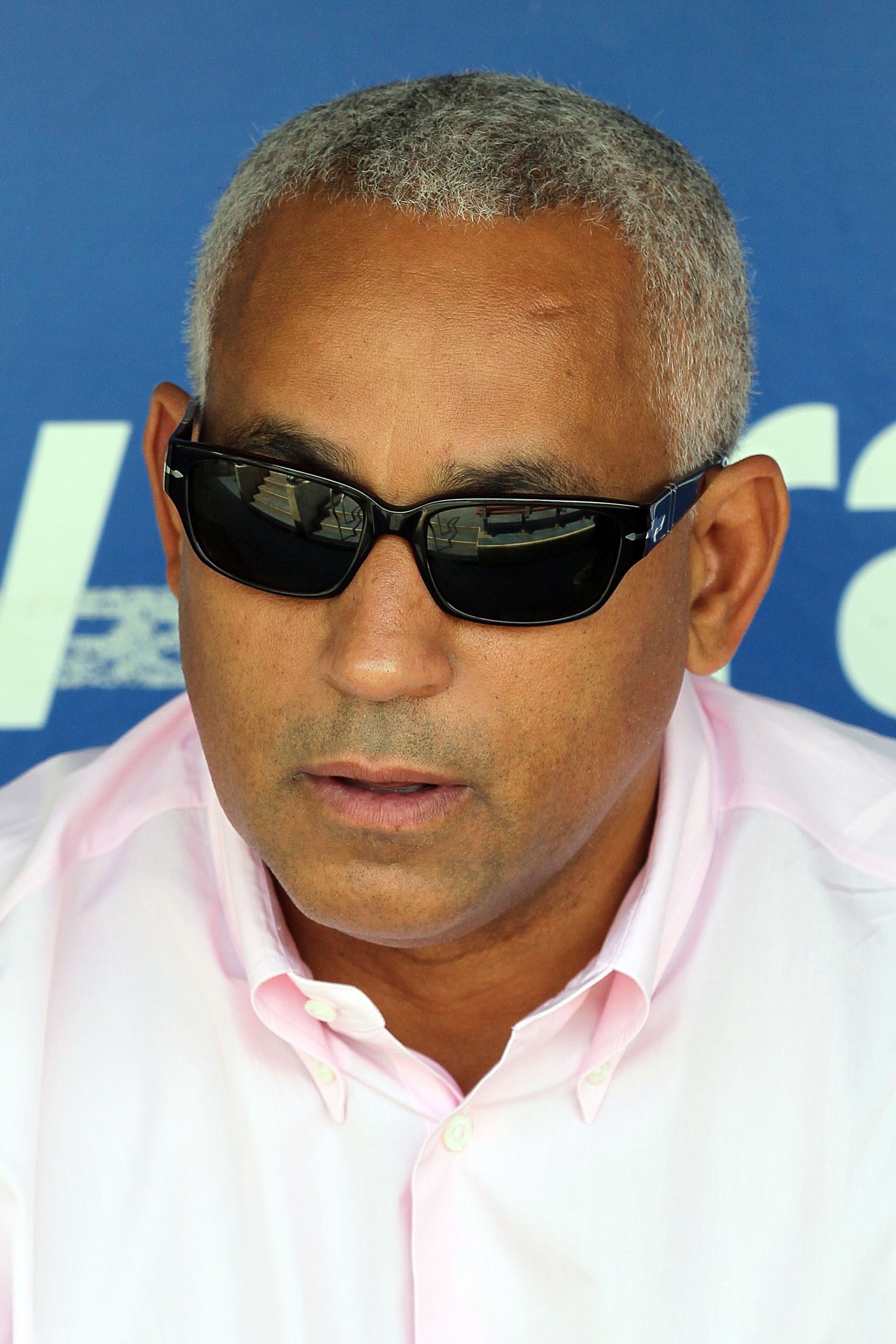 PHILADELPHIA - MAY 01:  General manager Omar Minaya of the New York Mets looks on as his team takes batting practice before playing the Philadelphia Phillies at Citizens Bank Park on May 1, 2010 in Philadelphia, Pennsylvania.  (Photo by Jim McIsaac/Getty