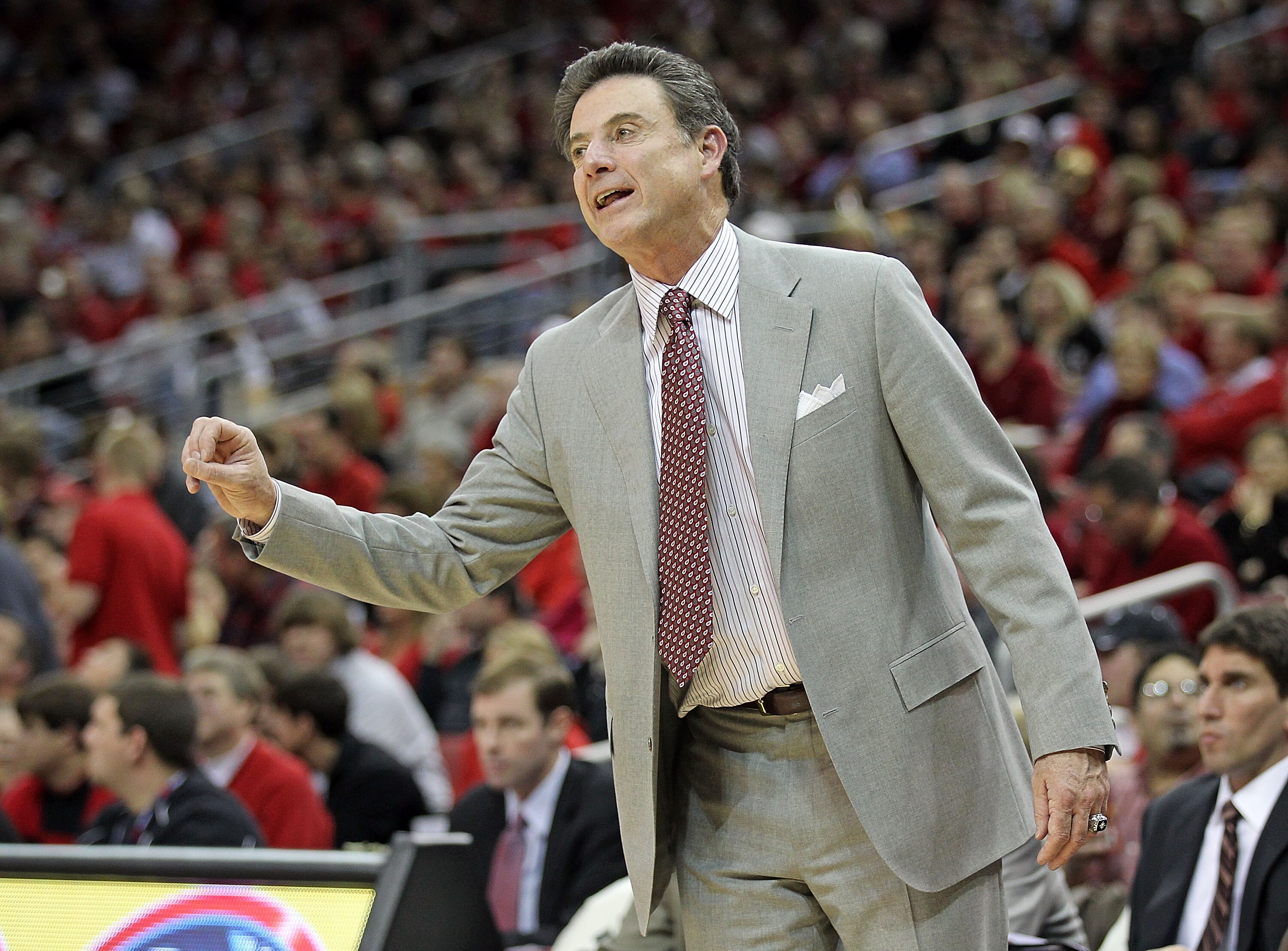 LOUISVILLE, KY - NOVEMBER 27:  Rick Pitino the Head Coach of the Louisville Cardinals gives instructions to his team during the game against the Marshall Thundering Herd at the KFC Yum! Center on November 27, 2010 in Louisville, Kentucky.  Louisville won