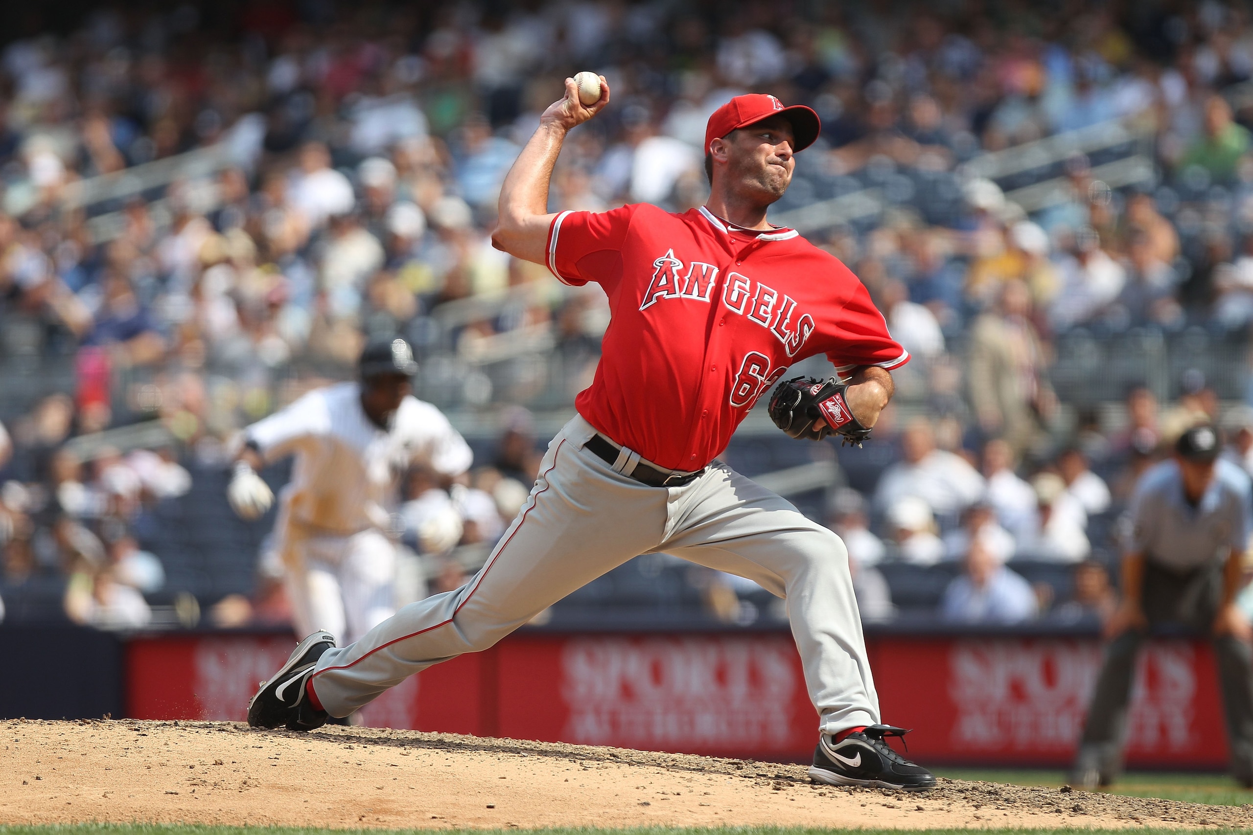 NEW YORK - JULY 21:  Scot Shields #62 of the Los Angeles Angels of Anaheim pitches against the New York Yankees at Yankee Stadium on July 21, 2010 in the Bronx borough of New York City.  (Photo by Nick Laham/Getty Images)
