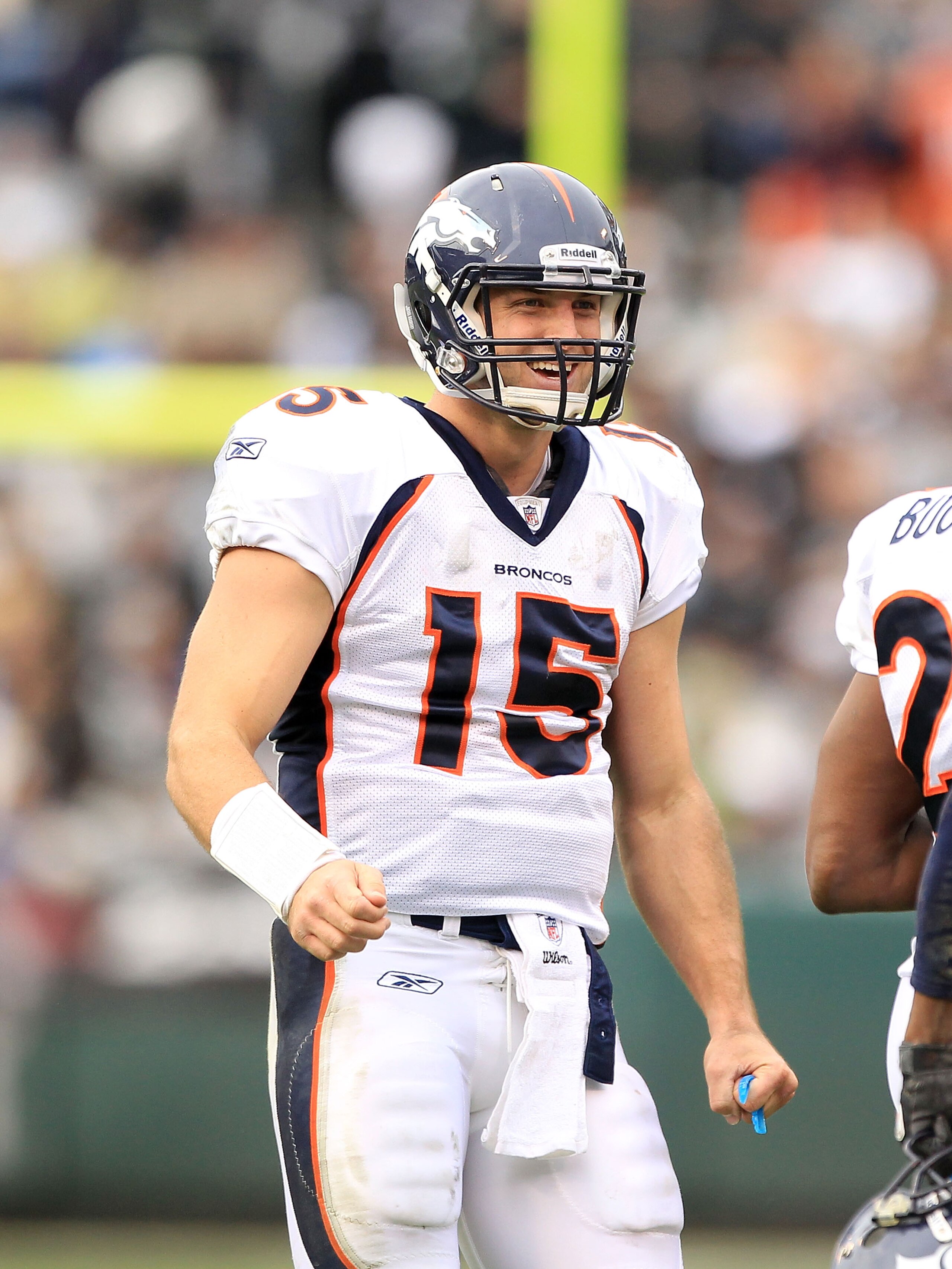 OAKLAND, CA - DECEMBER 19:  Tim Tebow #15 of the Denver Broncos smiles after the Broncos scored a touchdown during their game against the Oakland Raiders at Oakland-Alameda County Coliseum on December 19, 2010 in Oakland, California.  (Photo by Ezra Shaw/